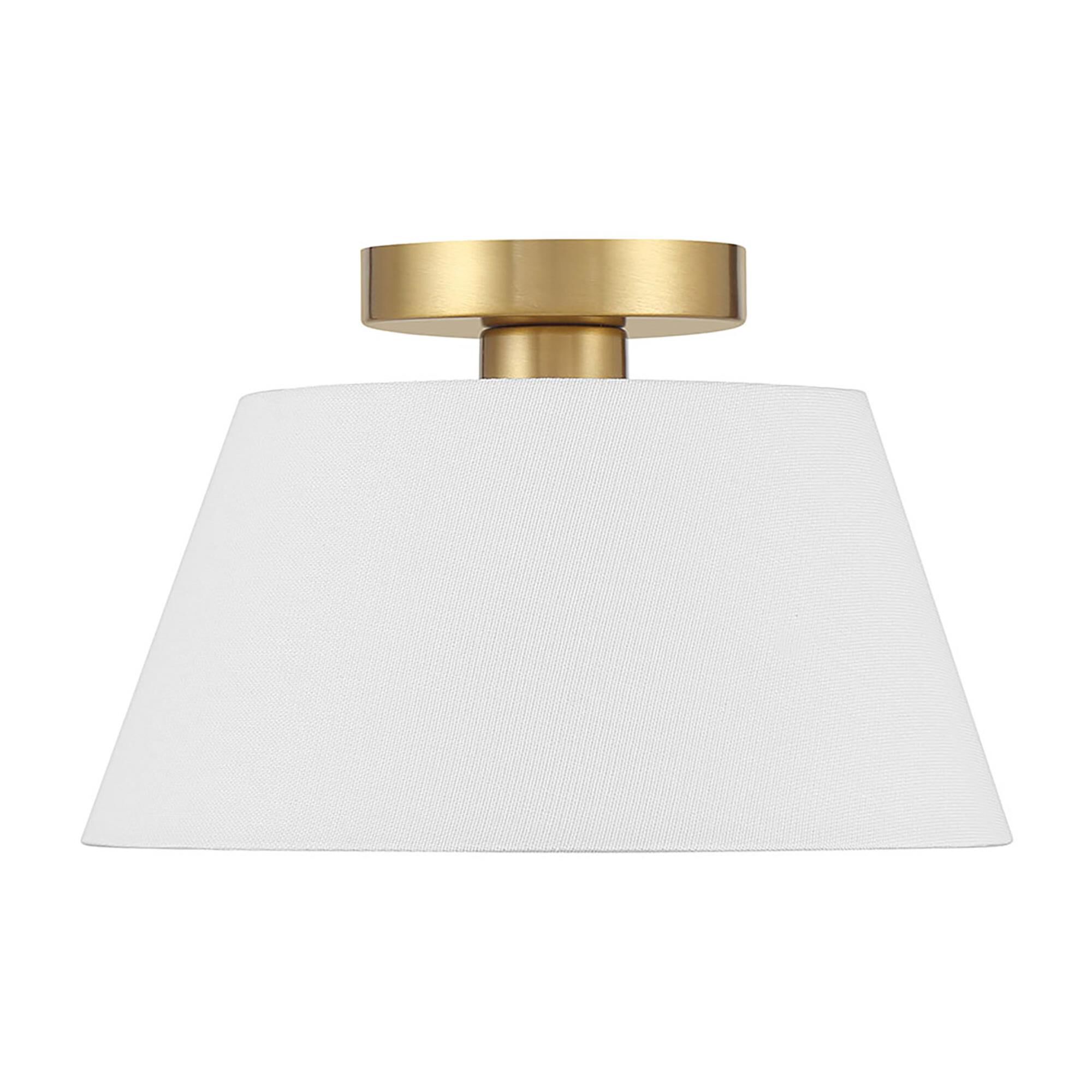 Shown in Natural Brass finish and White Linen Fabric shade