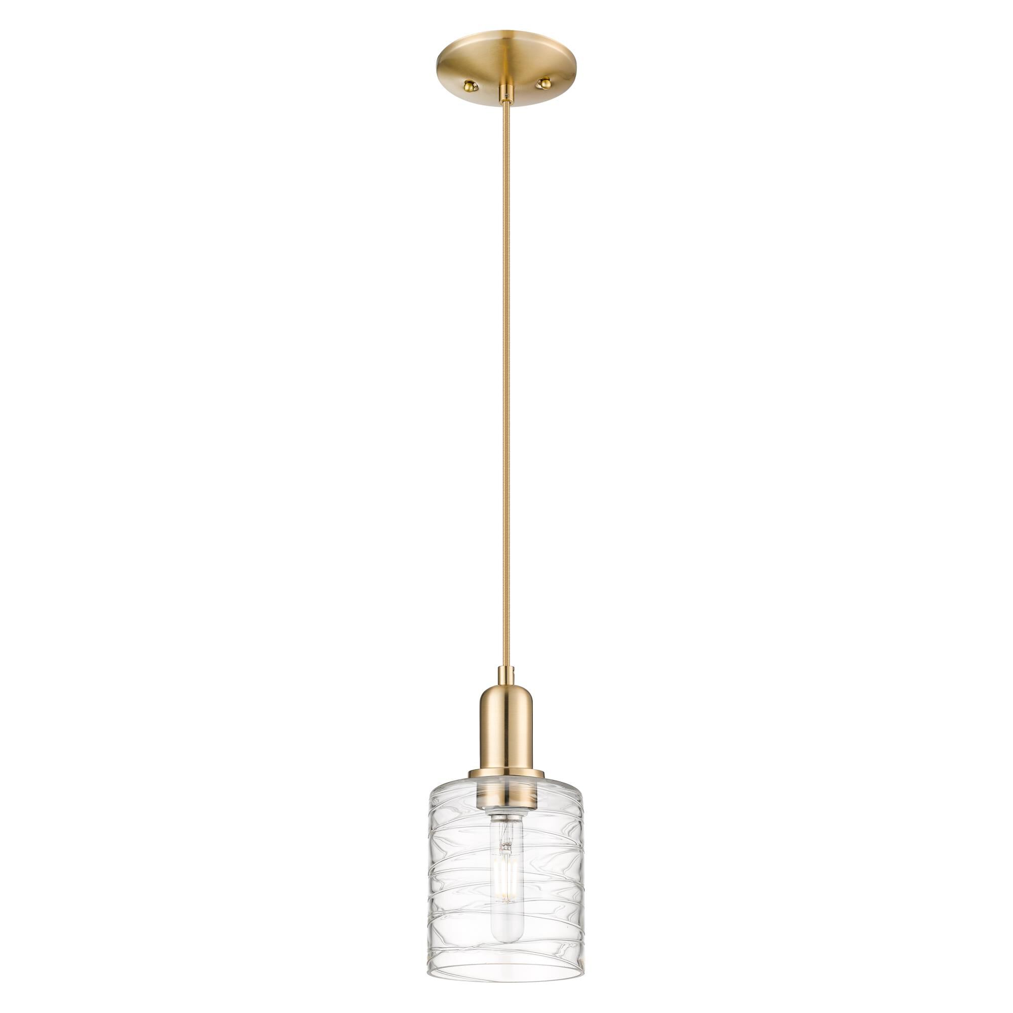 Shown in Champagne Bronze finish and Deco Swirl glass