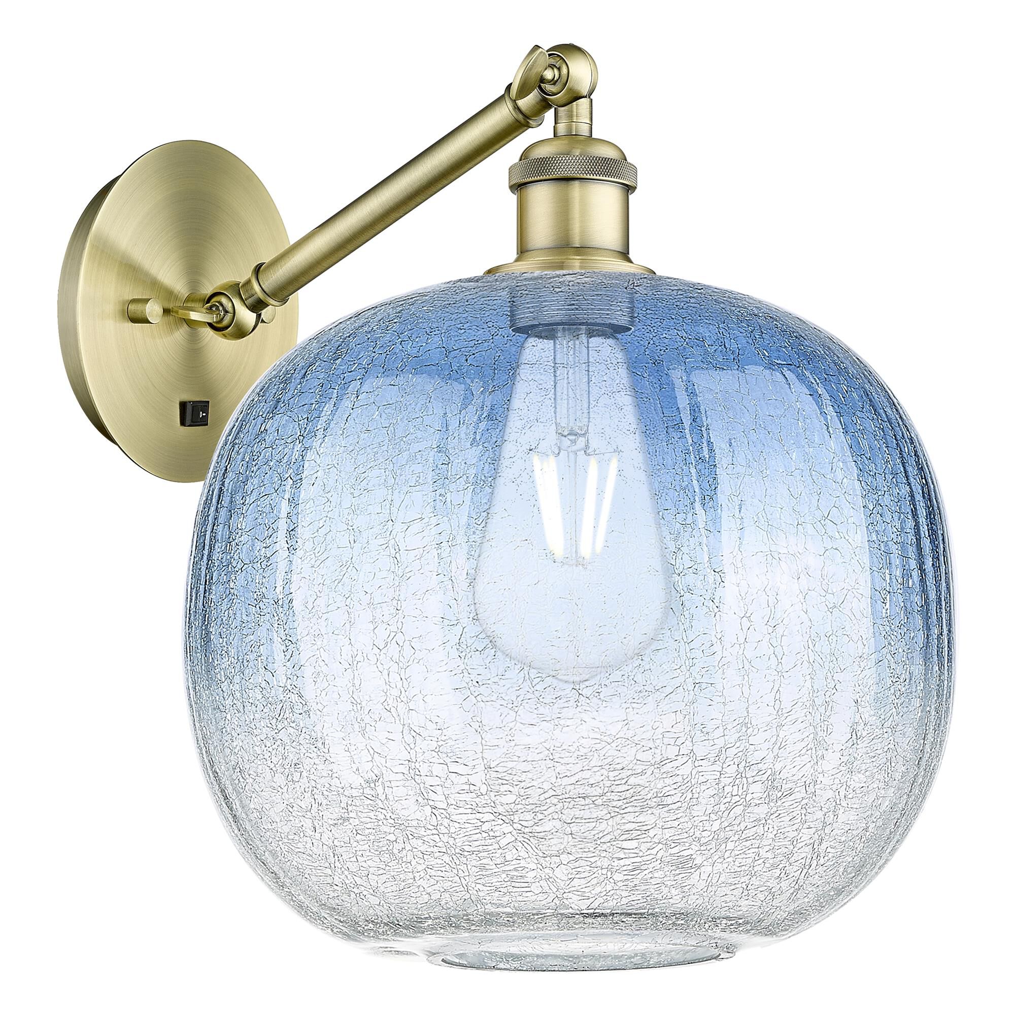 Shown in Antique Brass finish and Sapphire Blue glass