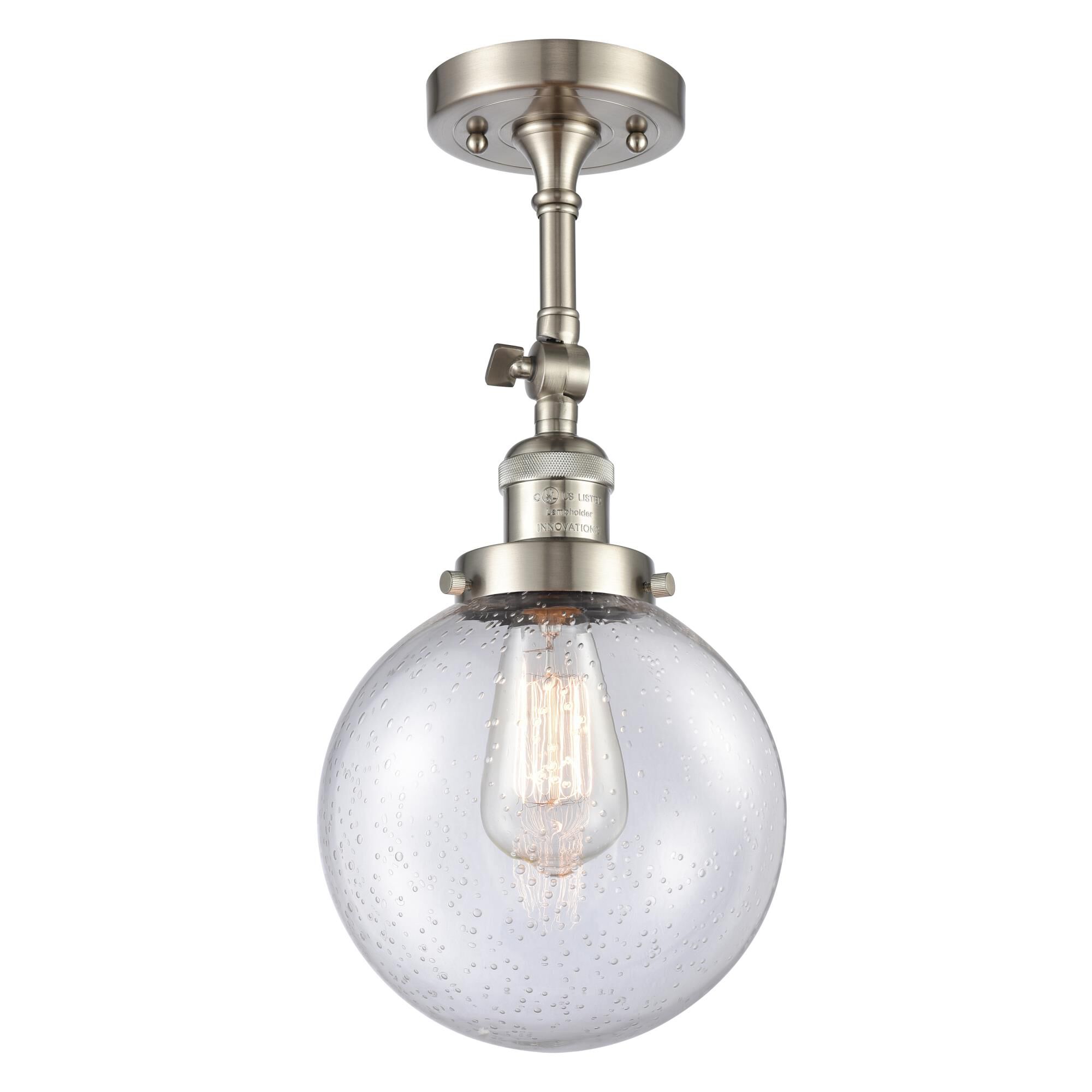 Shown in Brushed Satin Nickel finish and Seedy glass and No Accent accent