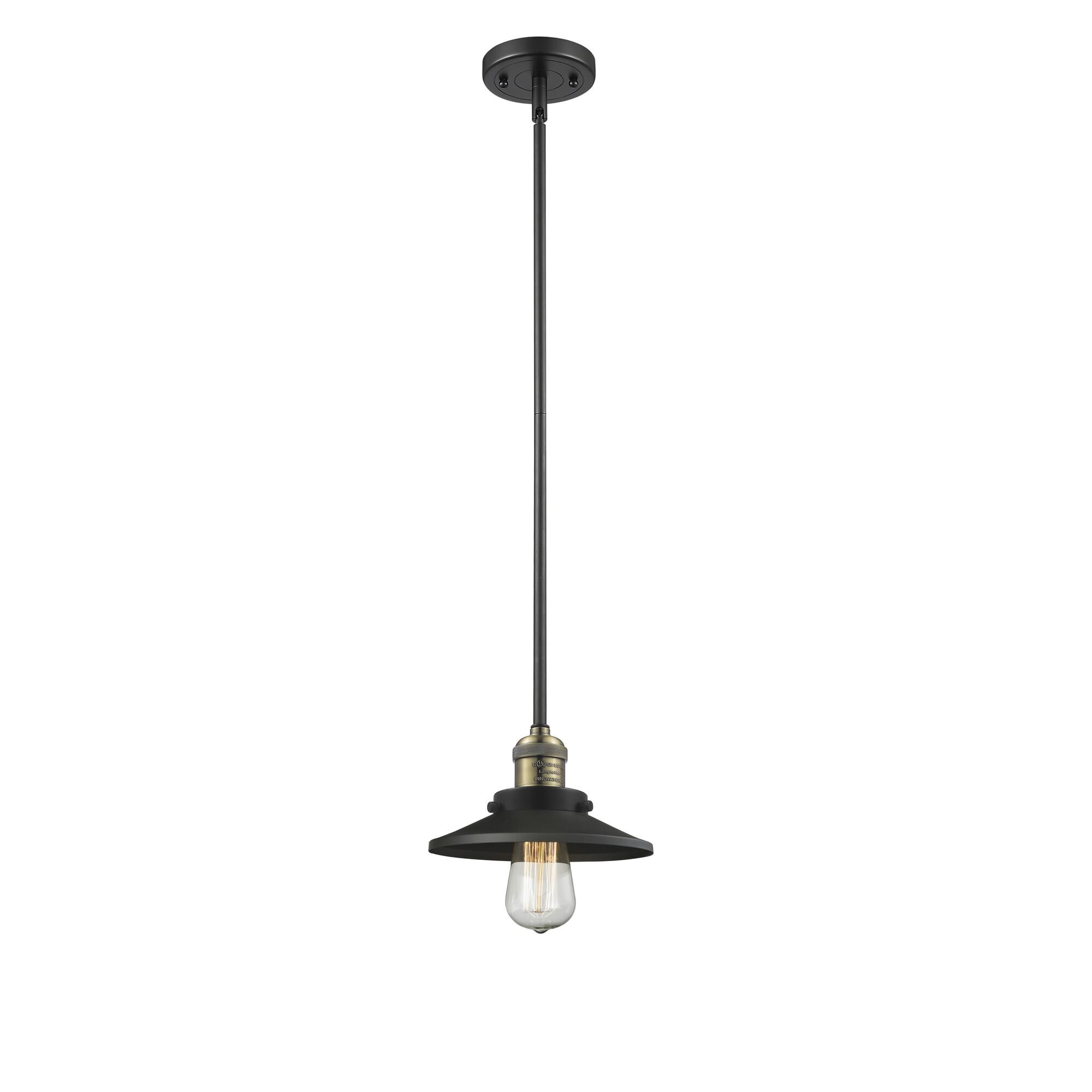 Shown in Black Antique Brass finish and Matte Black shade