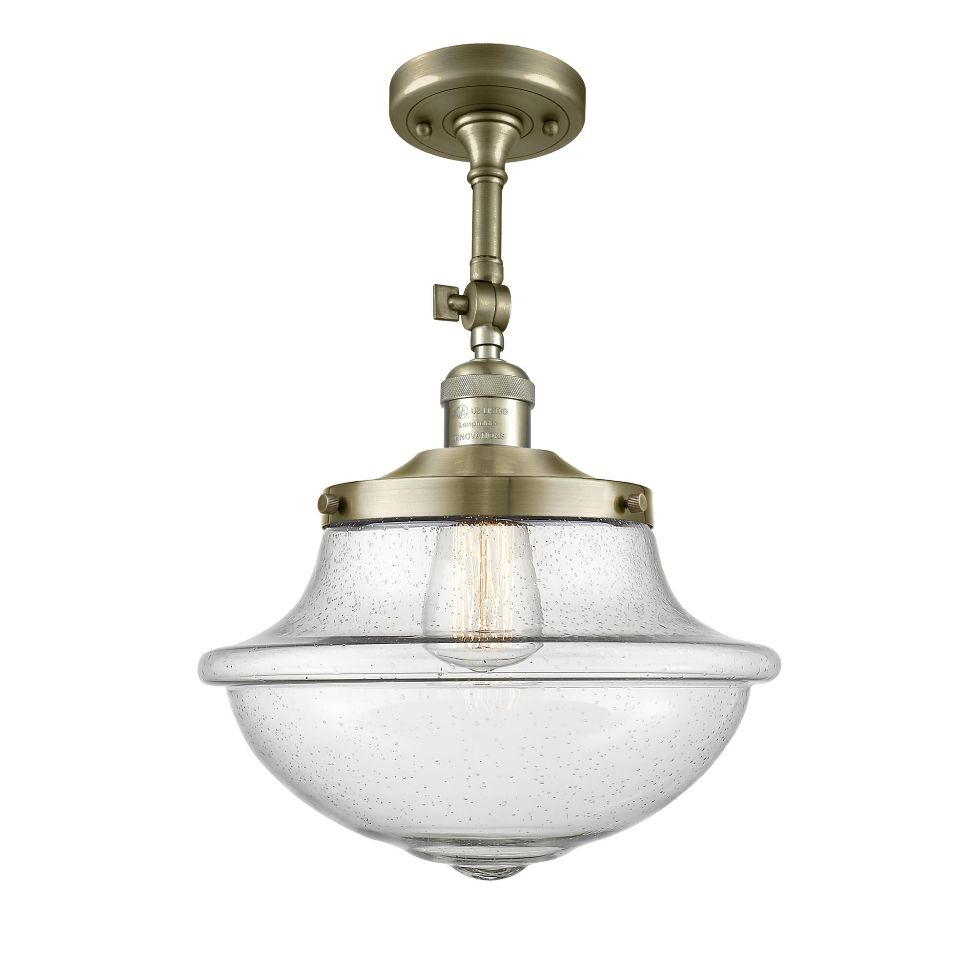 Shown in Antique Brass finish and Schoolhouse glass and Glass shade