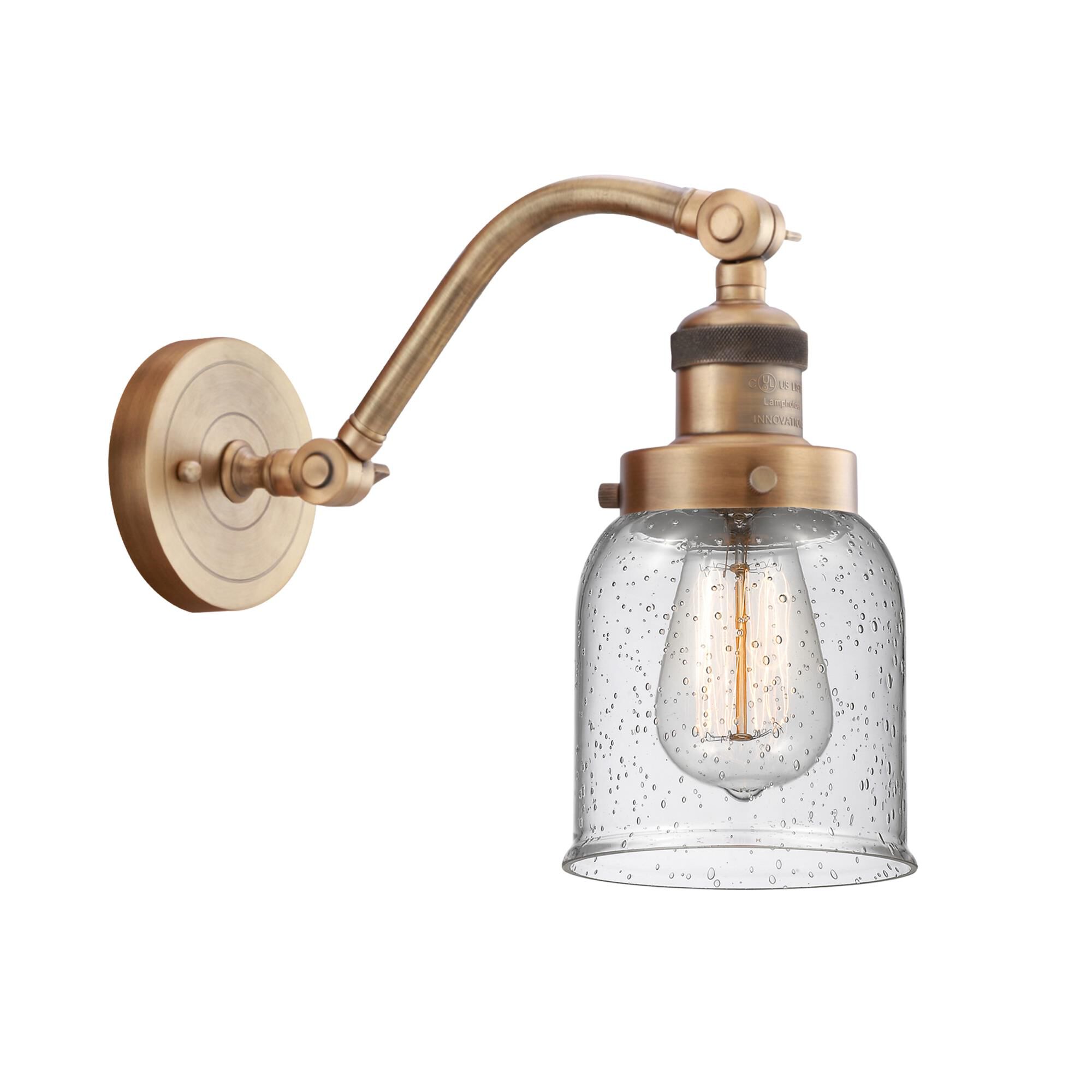 Shown in Brushed Brass finish and Seedy Small Bell glass