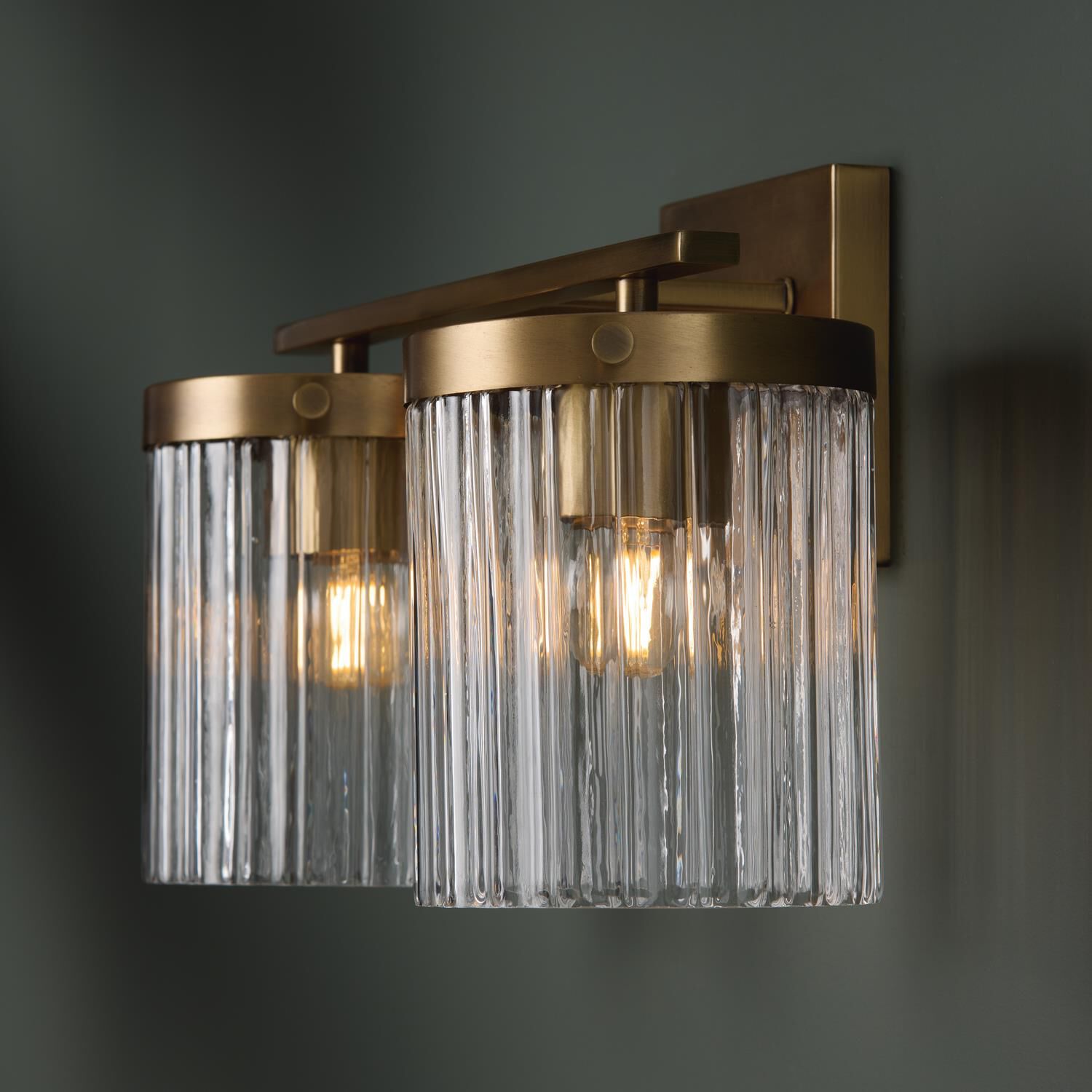 Shown in Aged Brass finish and Beveled Fluted glass