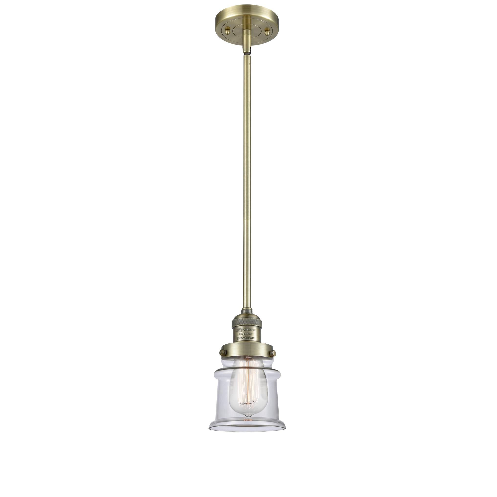 Shown in Antique Brass finish and Clear glass
