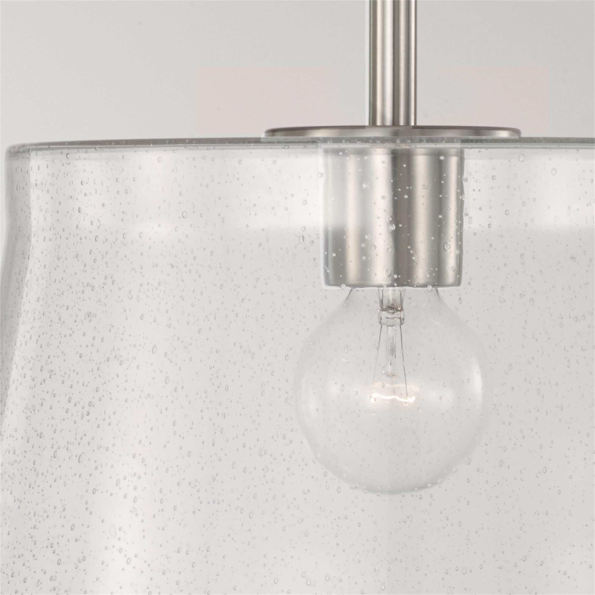 Shown in Brushed Nickel finish and Clear Seeded glass