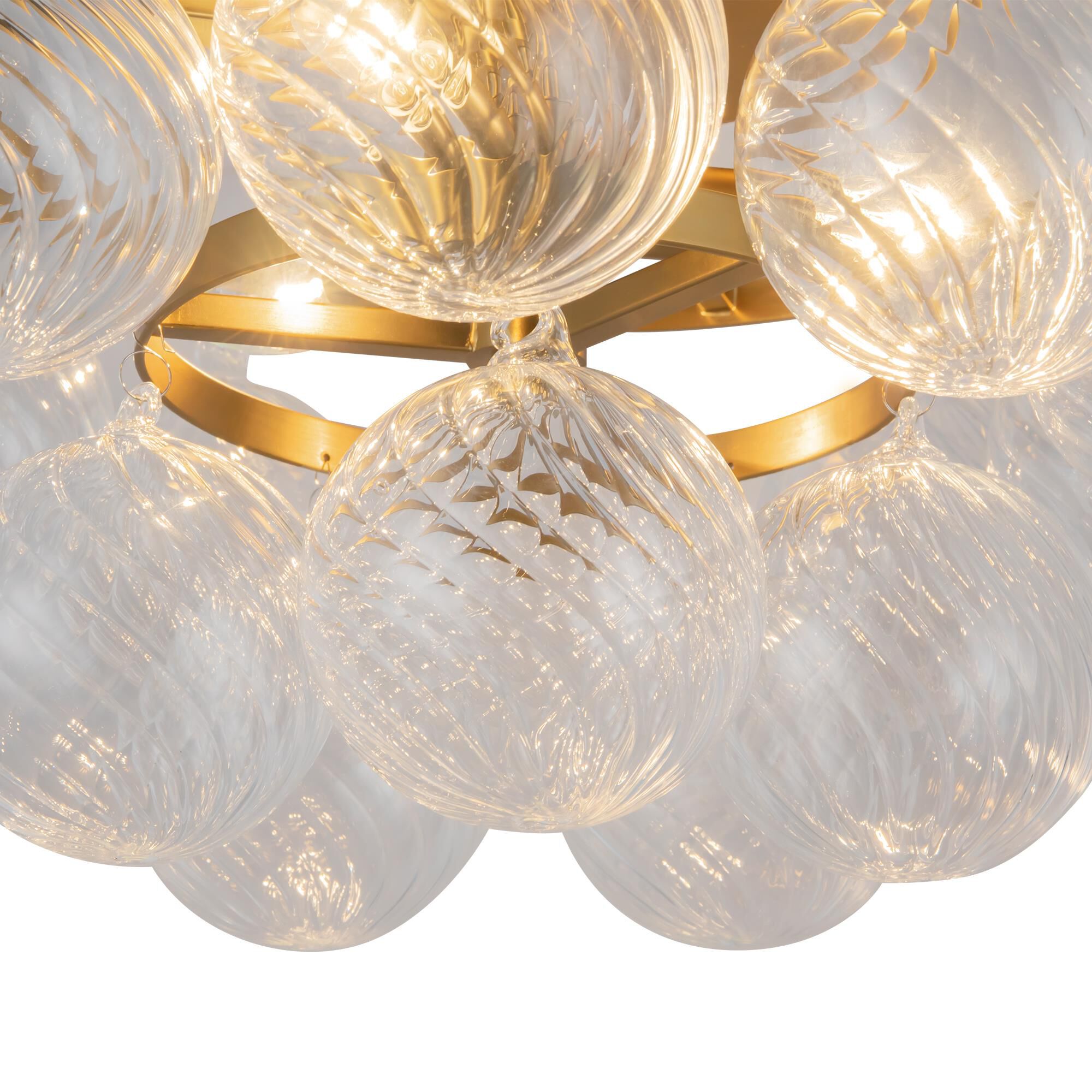 Shown in Brushed Gold finish and Clear Ribbed glass