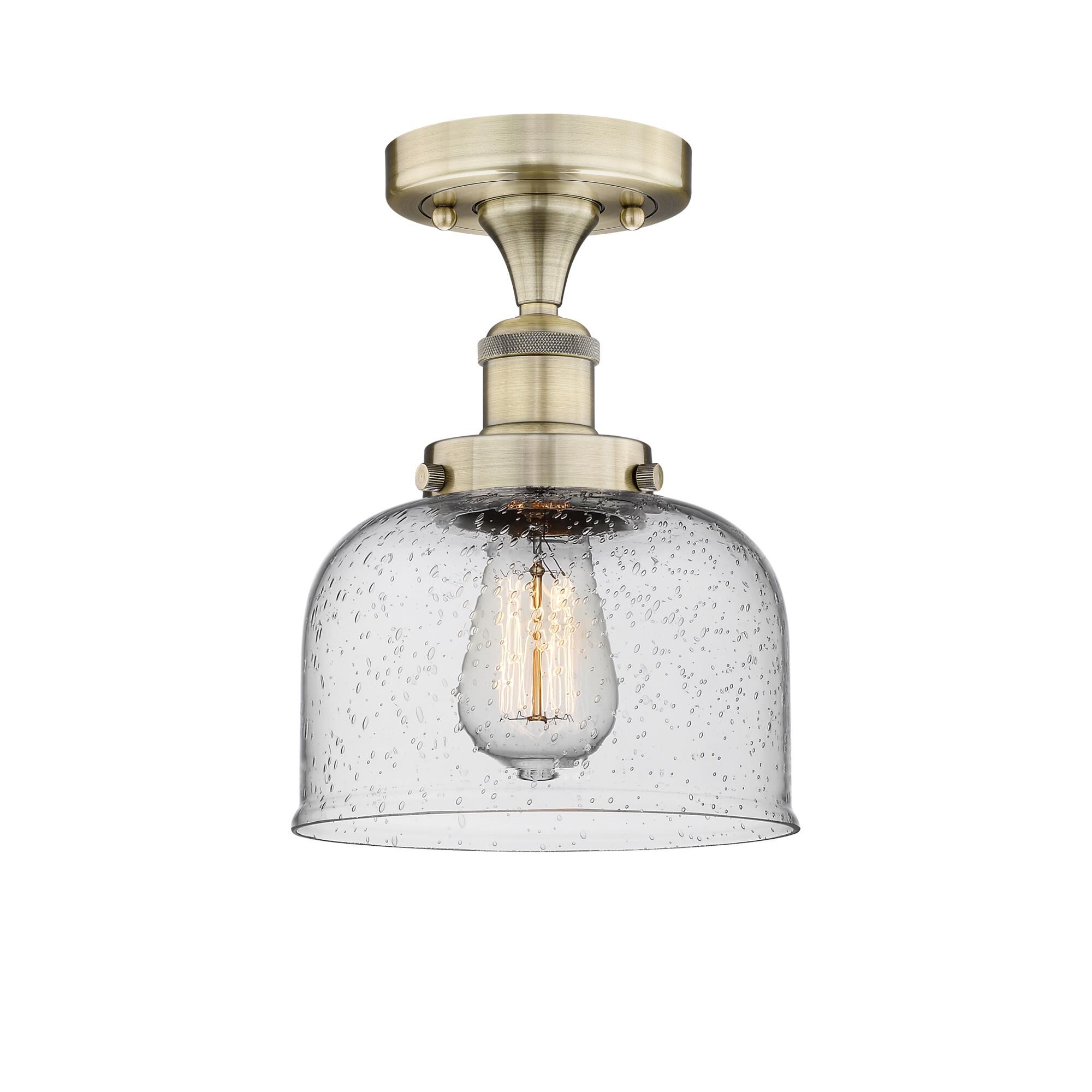 Shown in Antique Brass finish and Seedy glass