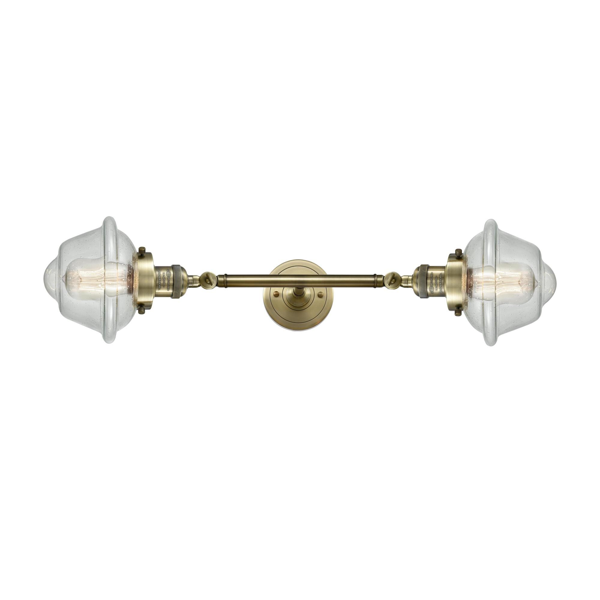 Shown in Antique Brass finish and Seedy glass