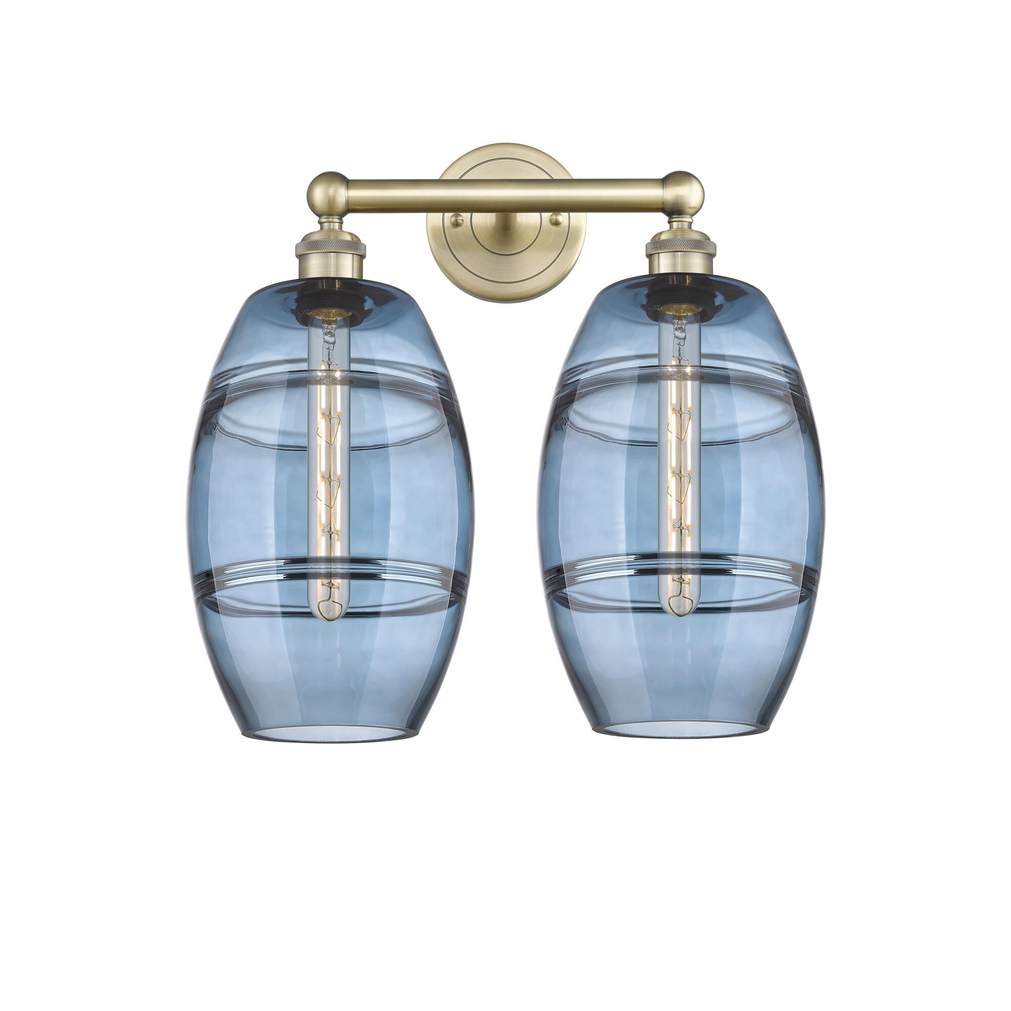 Shown in Antique Brass finish and Princess Blue glass