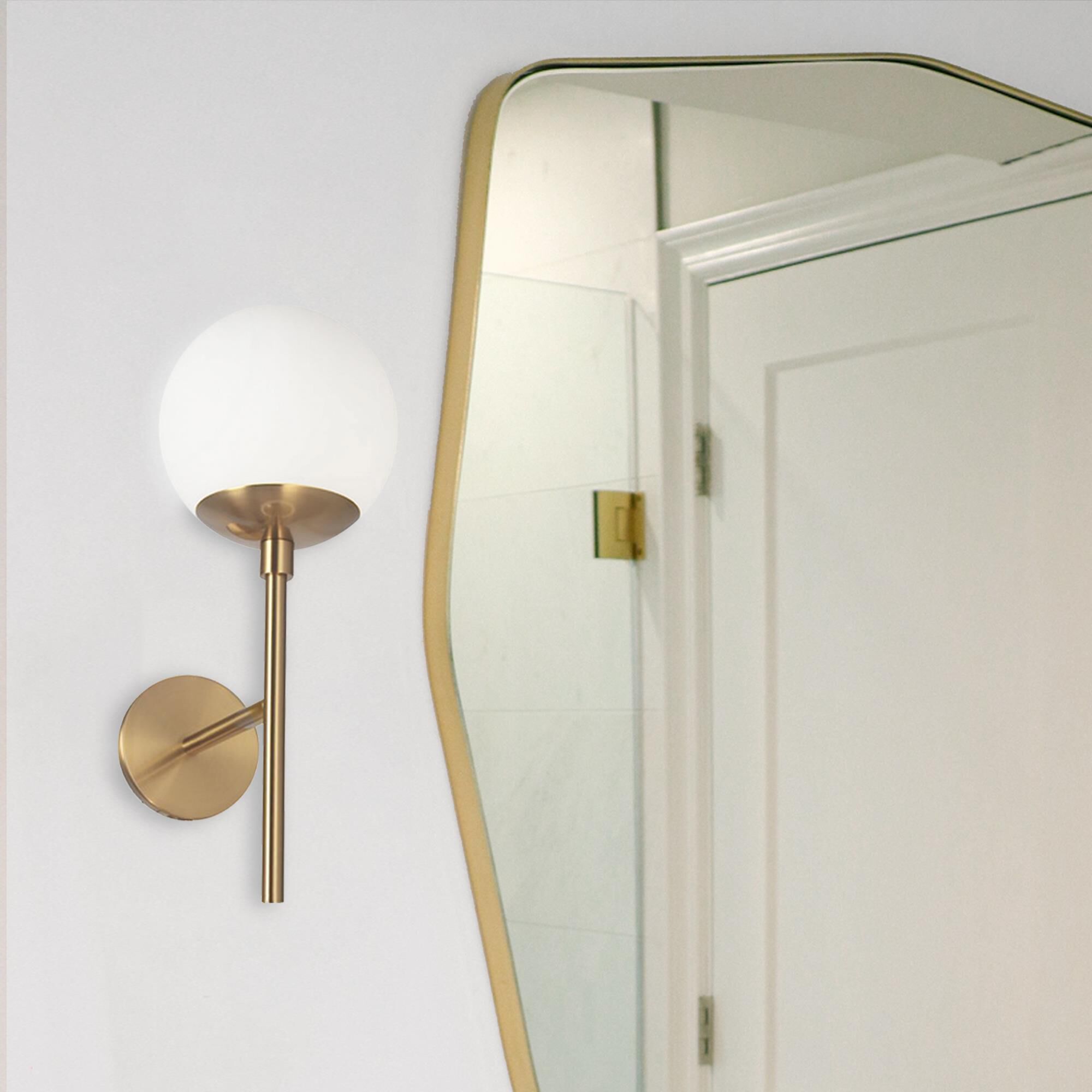 Shown in Aged Brass and White finish and White Globe glass