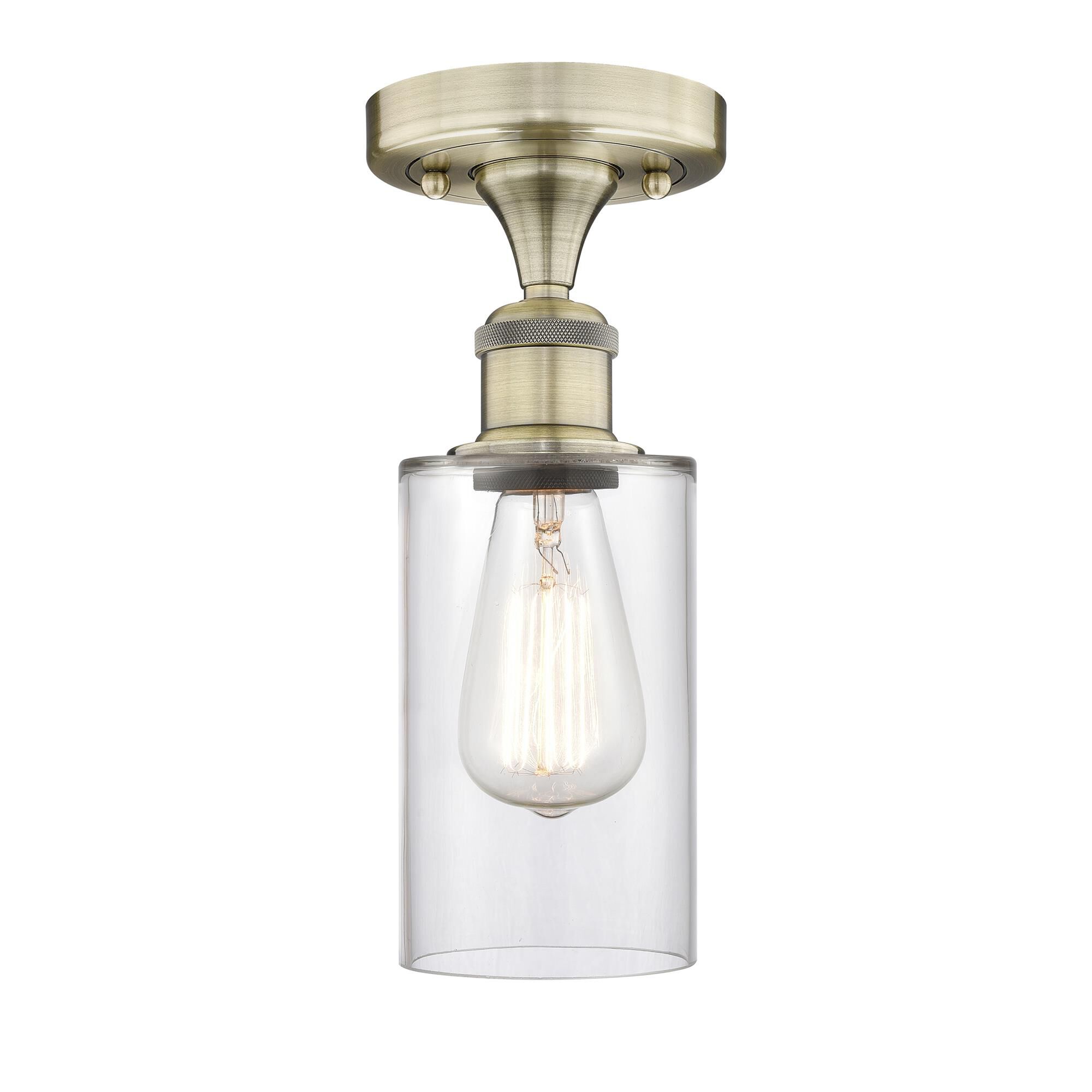 Shown in Antique Brass finish and Clear glass