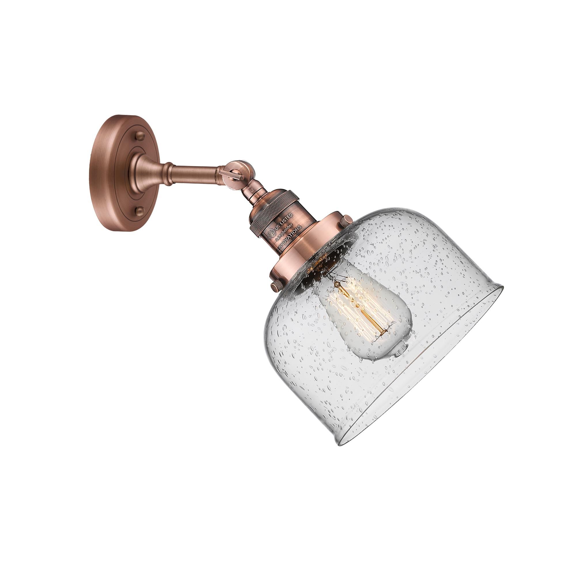 Shown in Antique Copper finish and Seedy glass and None accent