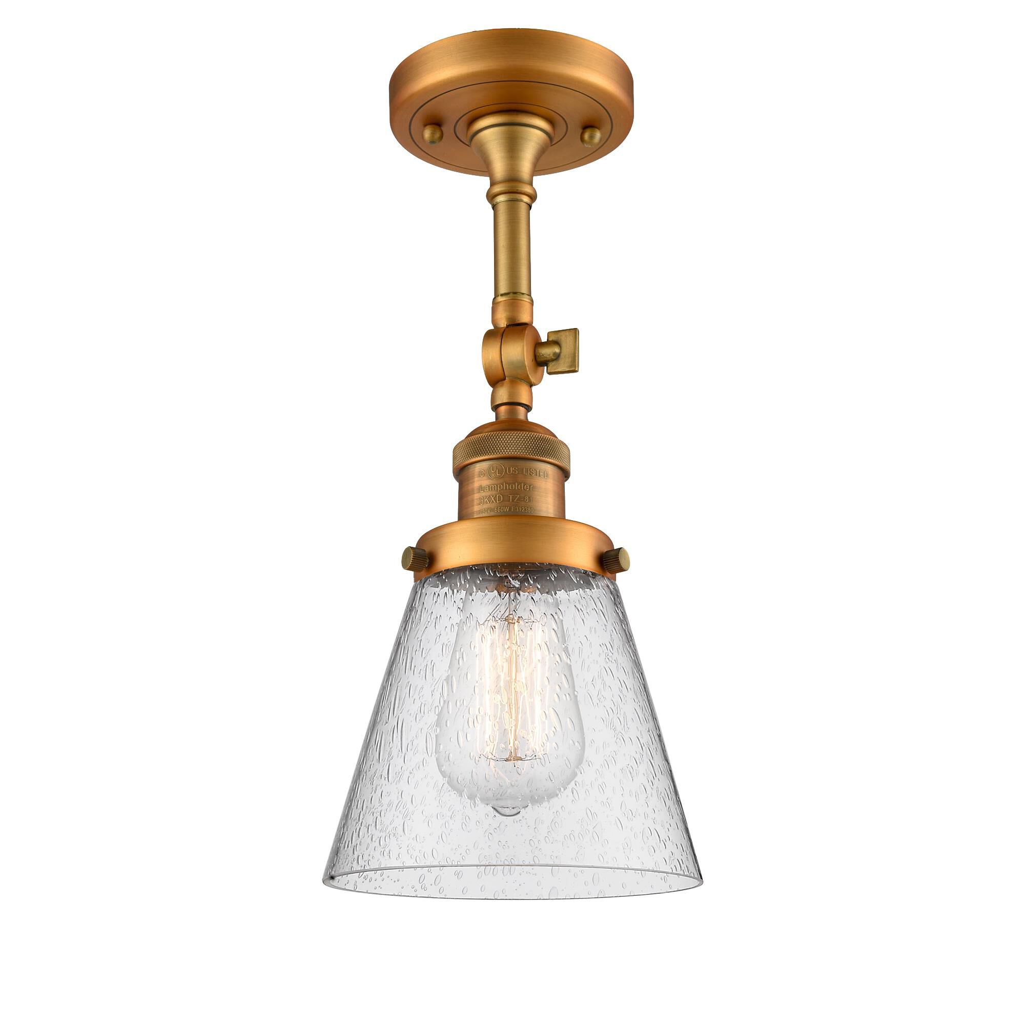 Shown in Brushed Brass finish and Seedy glass and None accent