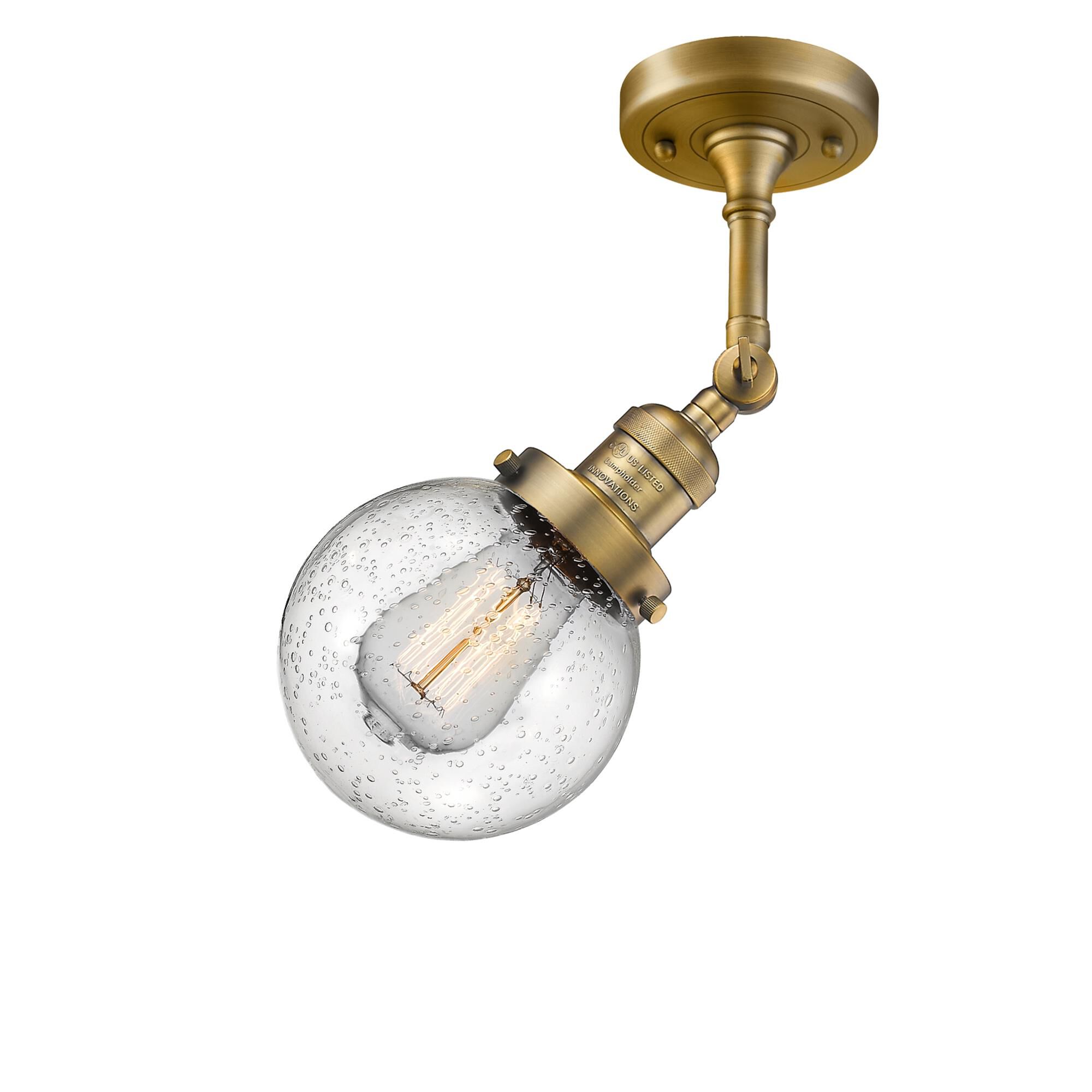 Shown in Brushed Brass finish and Seedy glass and No Accent accent