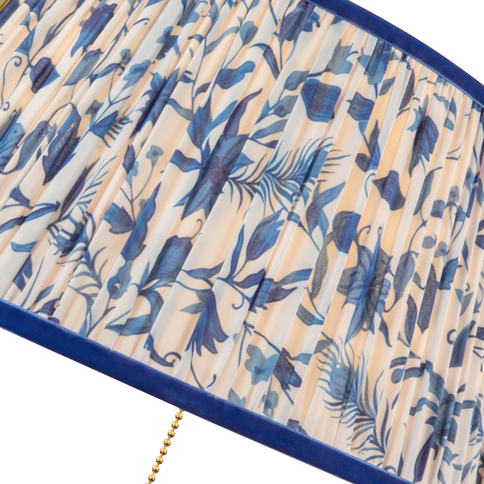 Shown in Brushed Gold finish and Blue Linen shade