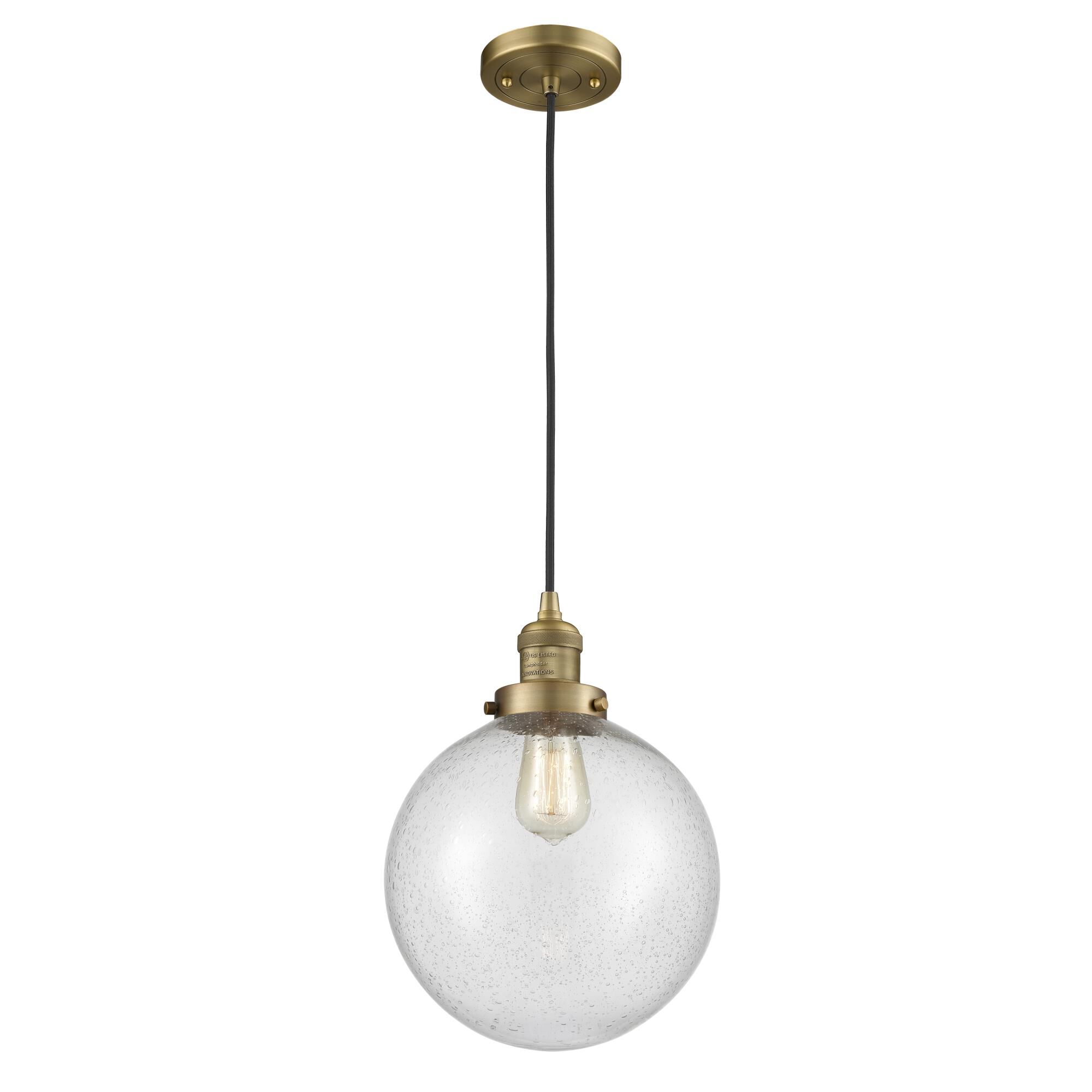 Shown in Brushed Brass finish and Seedy glass