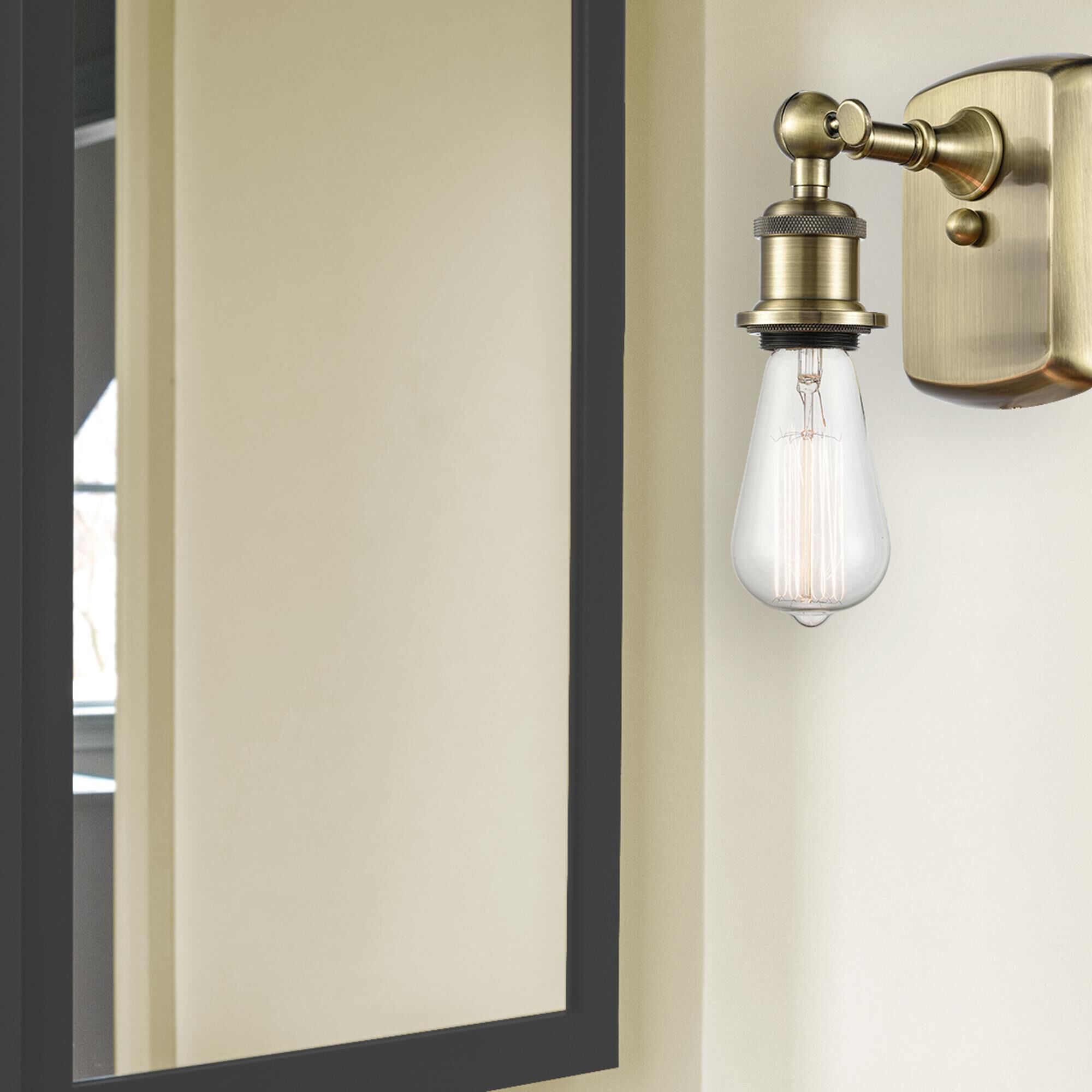 Shown in Antique Brass finish and None glass and None shade