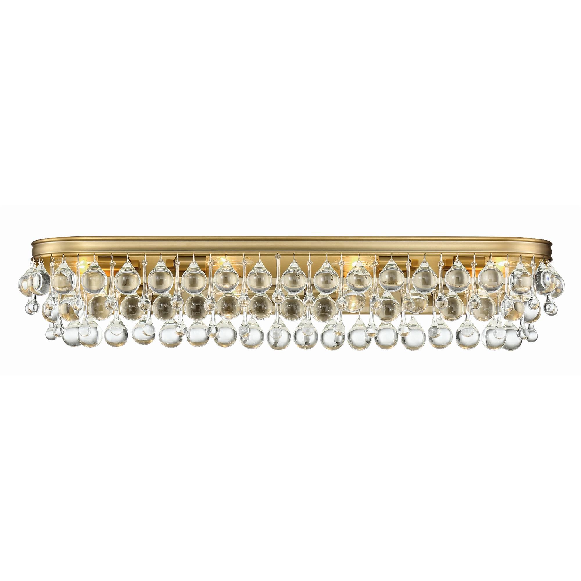 Shown in Vibrant Gold finish and Clear Glass Drops crystal