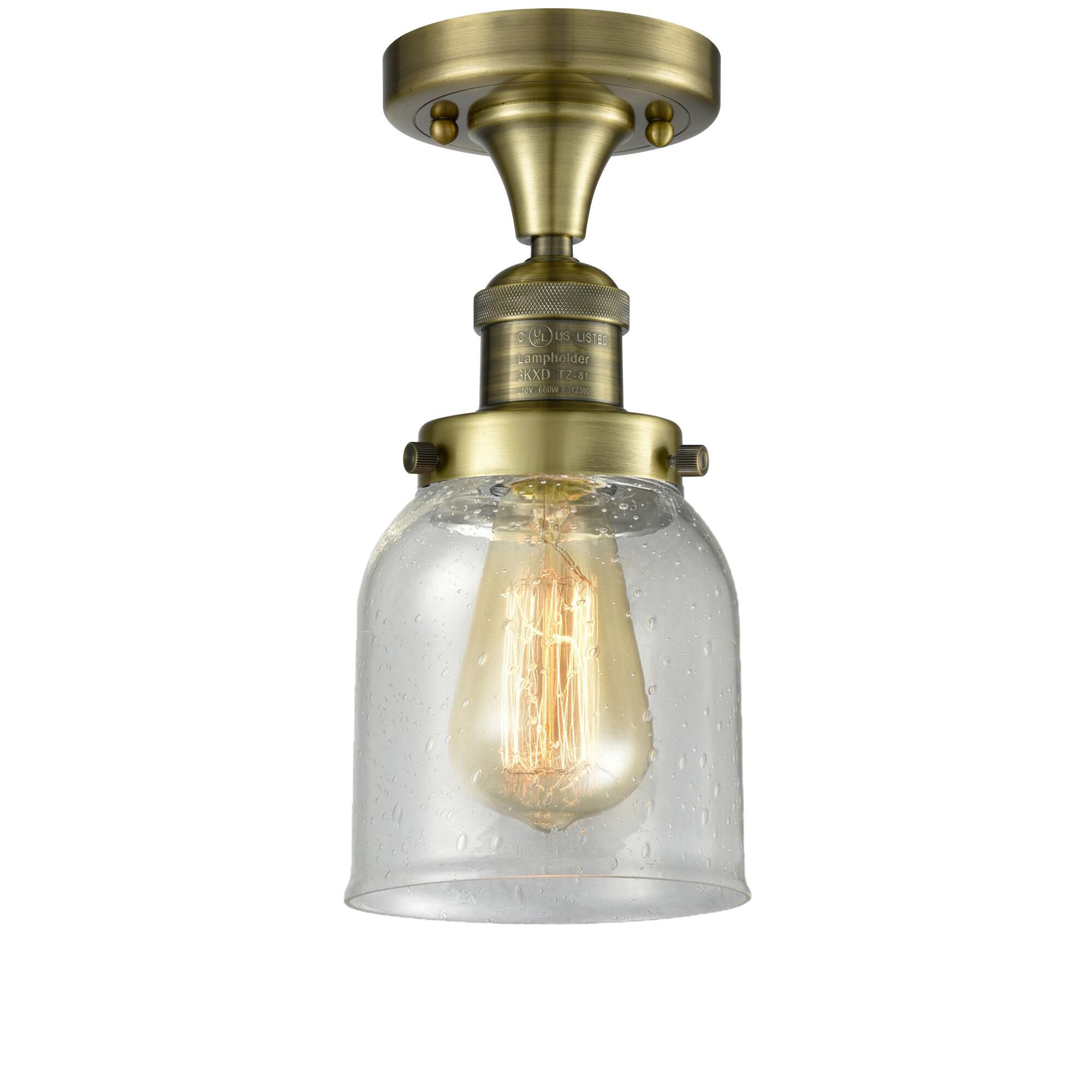 Shown in Antique Brass finish and Seedy glass