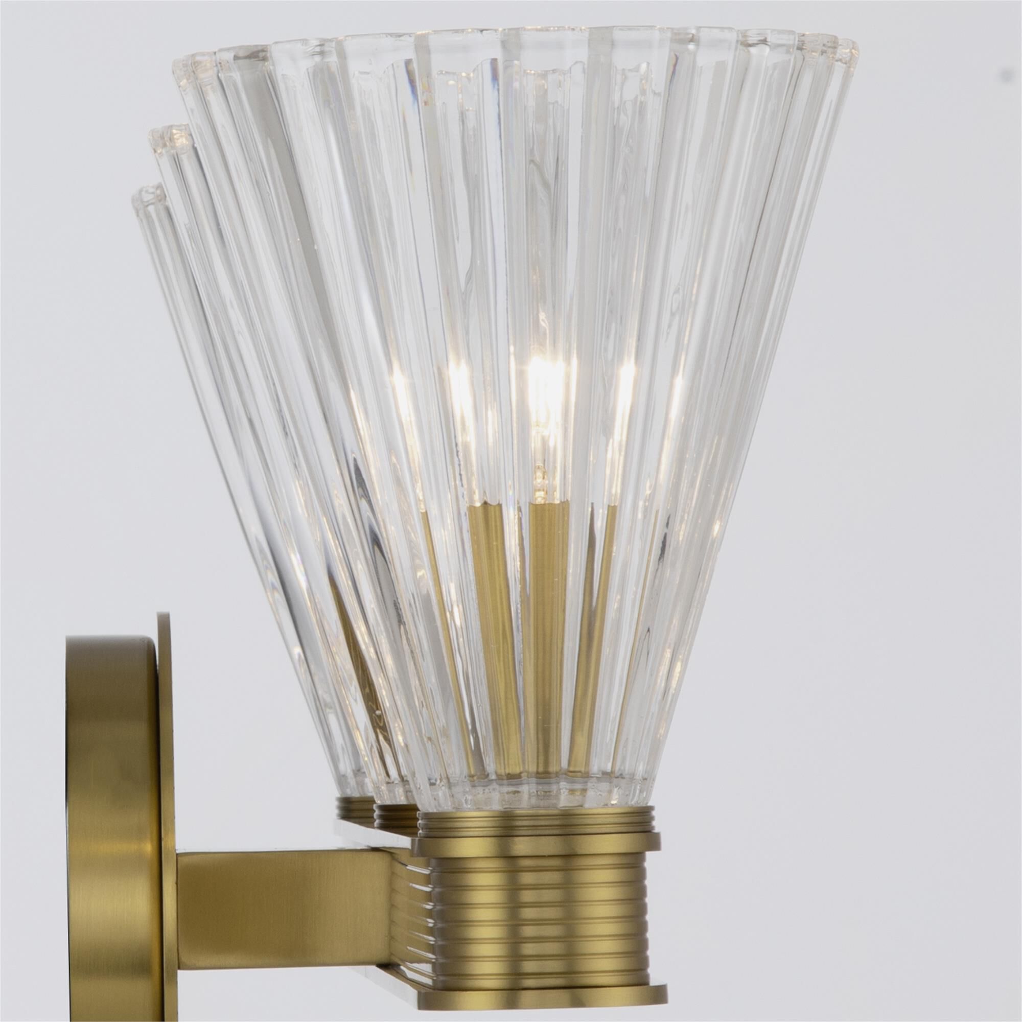 Shown in Luxe Gold finish and Glass shade