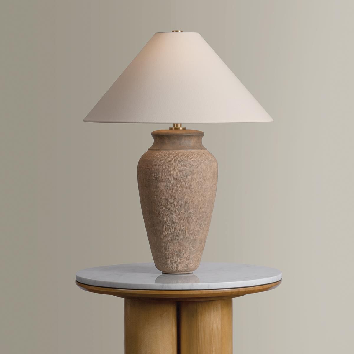 Shown in Patina Brass and Ceramic Textural Umber finish and Off White Linen shade