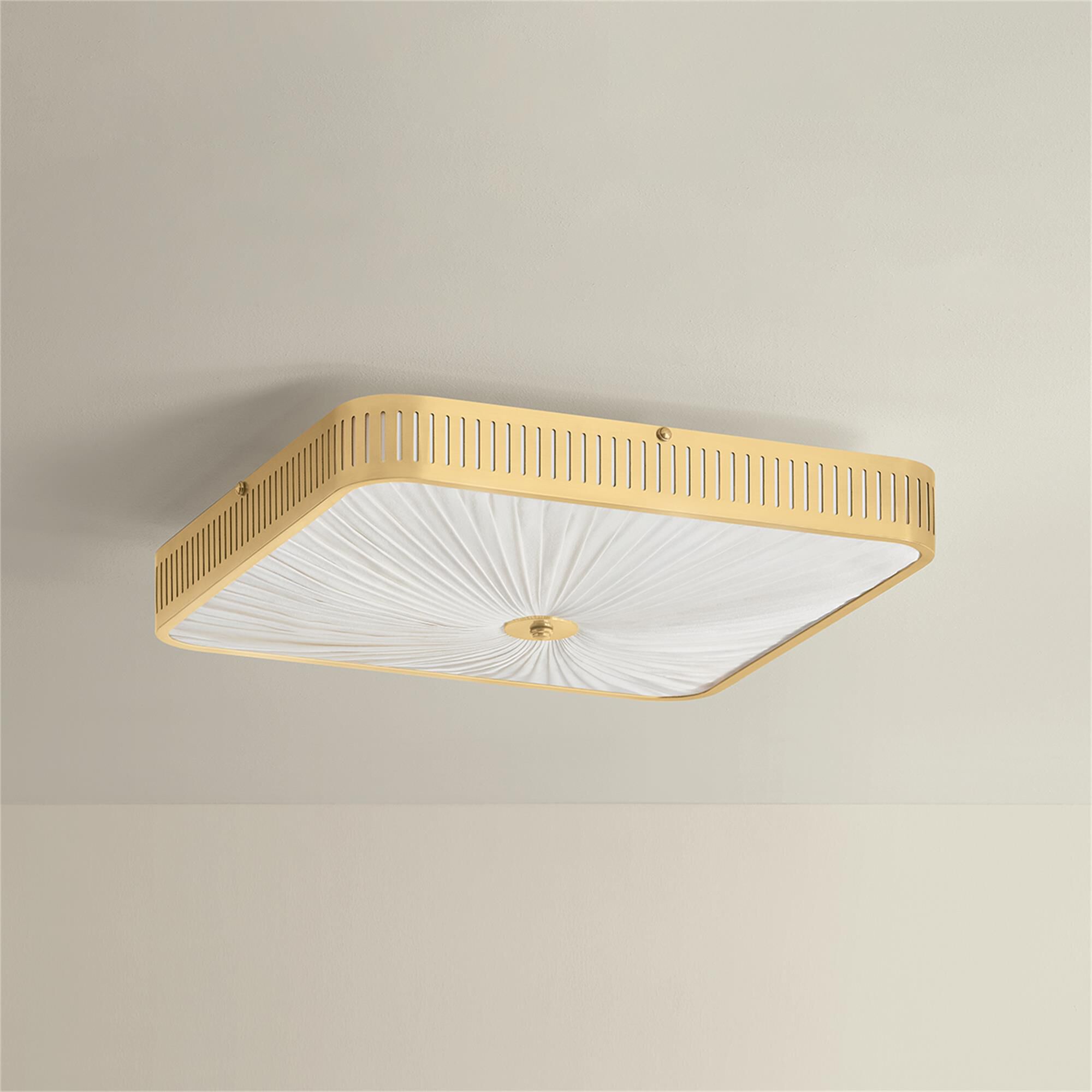 Shown in Aged Brass finish and Ivory Silk shade