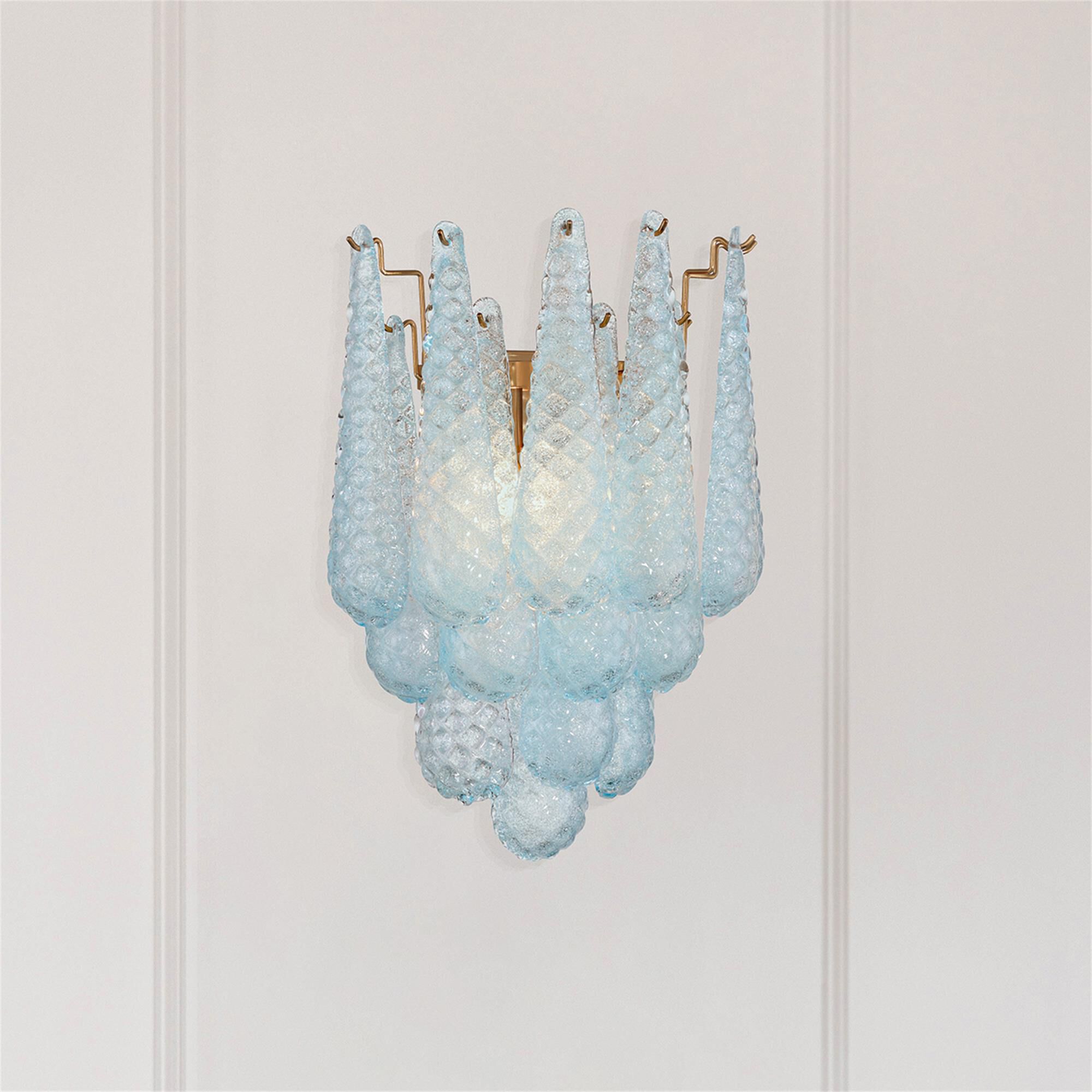 Shown in Aged Brass finish and Sand Blue glass