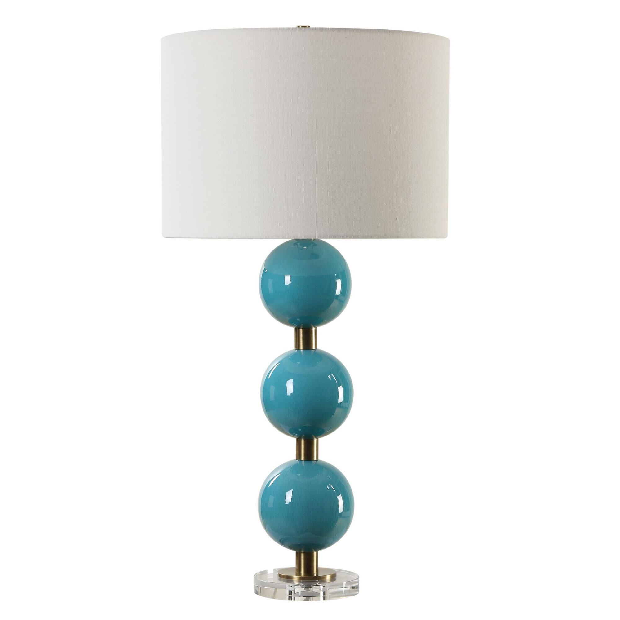 Shown in Elevate Your Space With Our Captivating Table Lamp Featuring Stacked Ceramic Spheres Adorned In A Cr finish and Round Drum Hardback shade