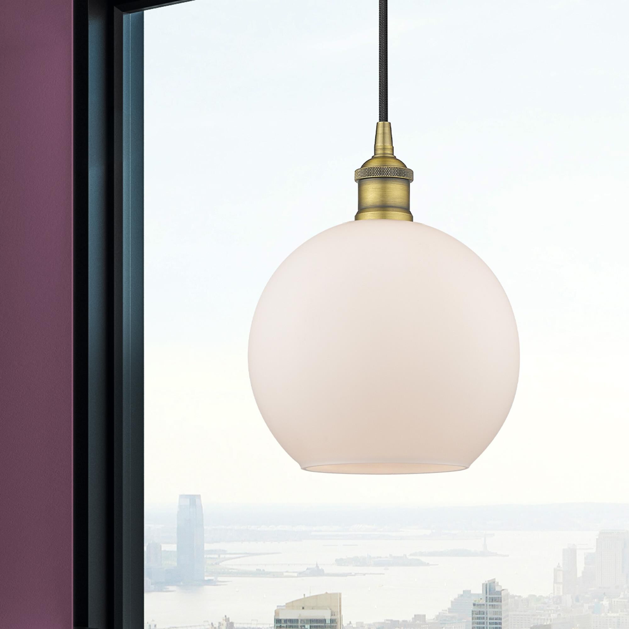 Shown in Brushed Brass finish and Cased Matte White glass