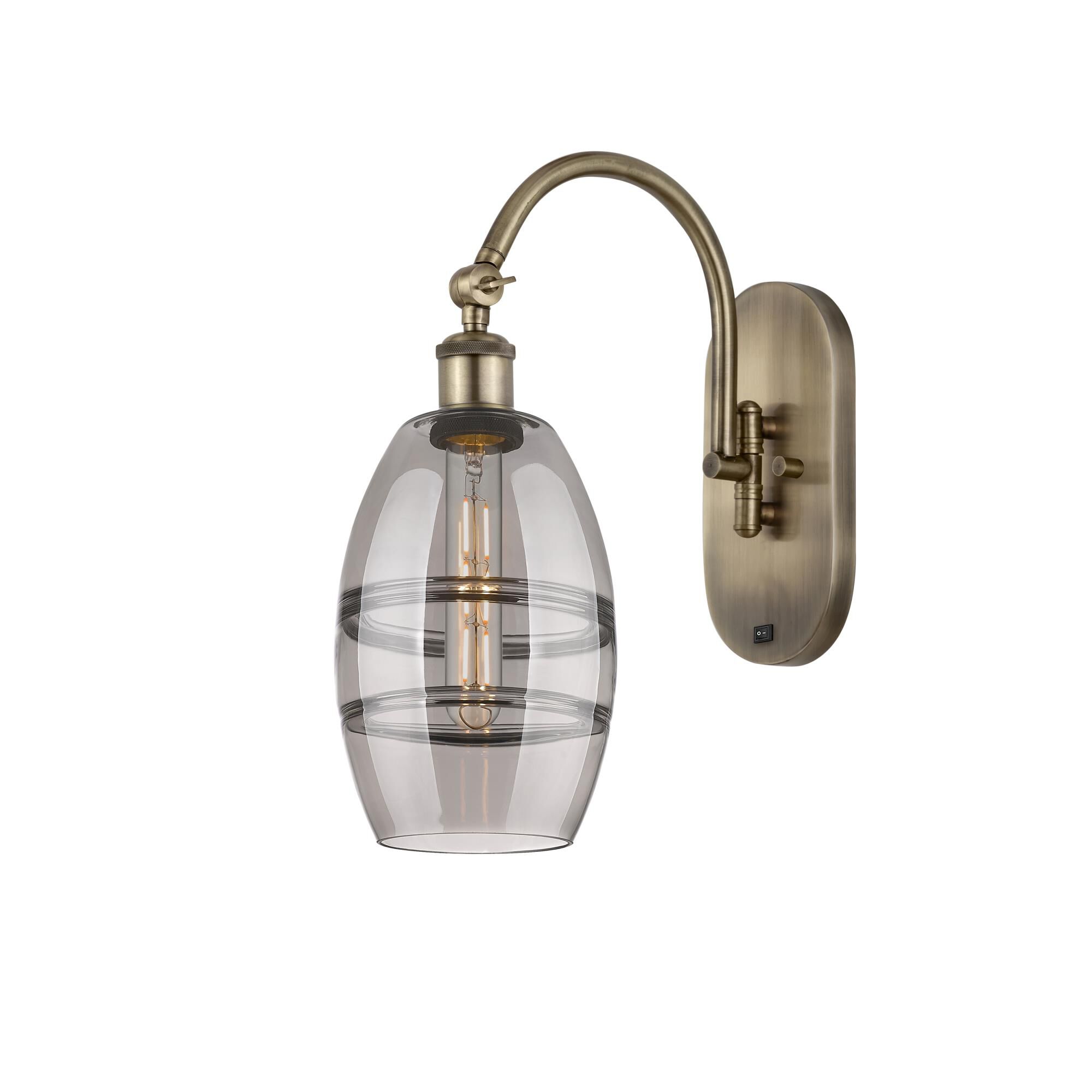 Shown in Antique Brass finish and Light Smoke glass