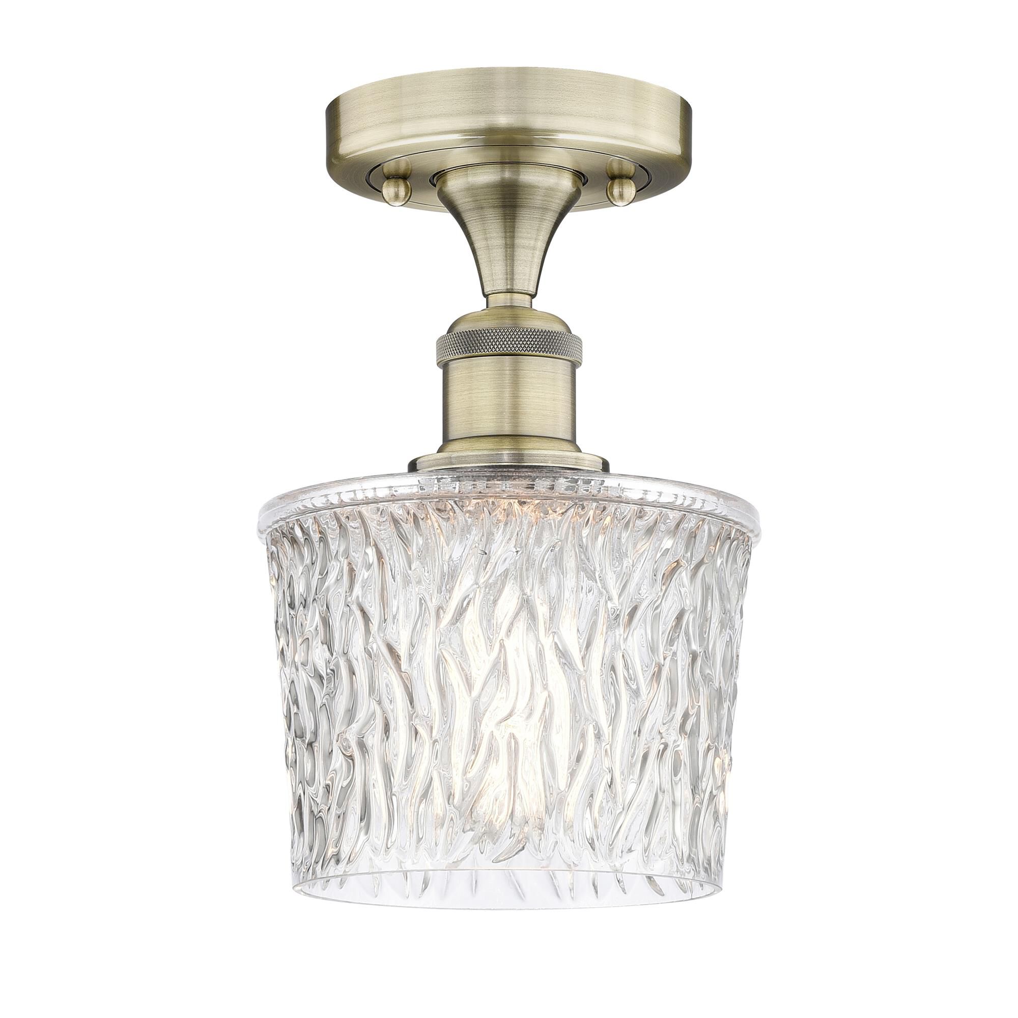 Shown in Antique Brass finish and Clear glass