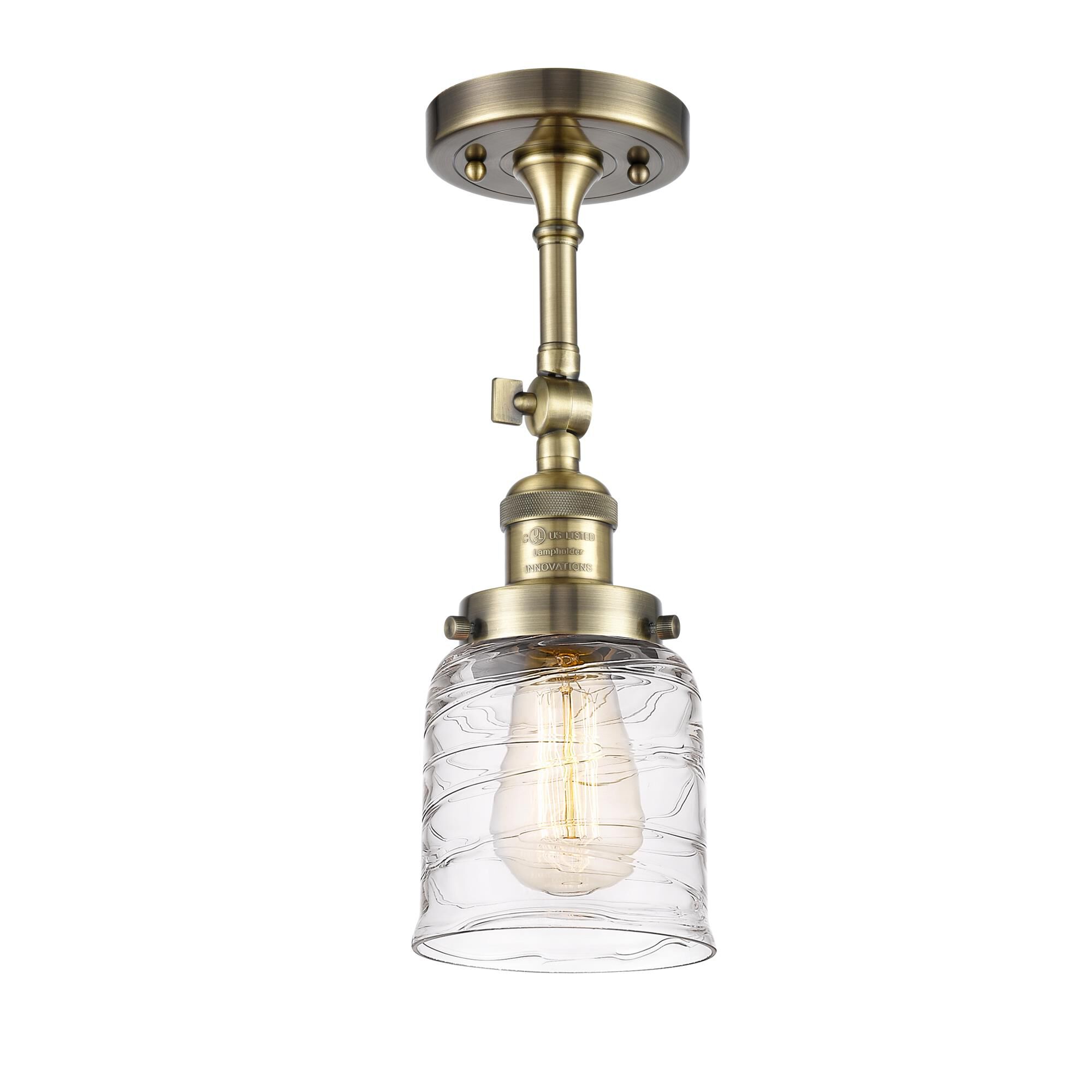 Shown in Antique Brass finish and Clear glass