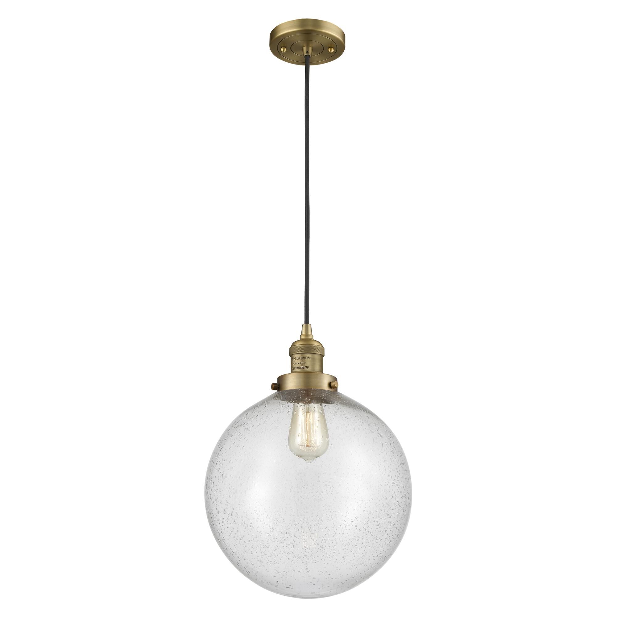 Shown in Brushed Brass finish and Seedy Beacon glass