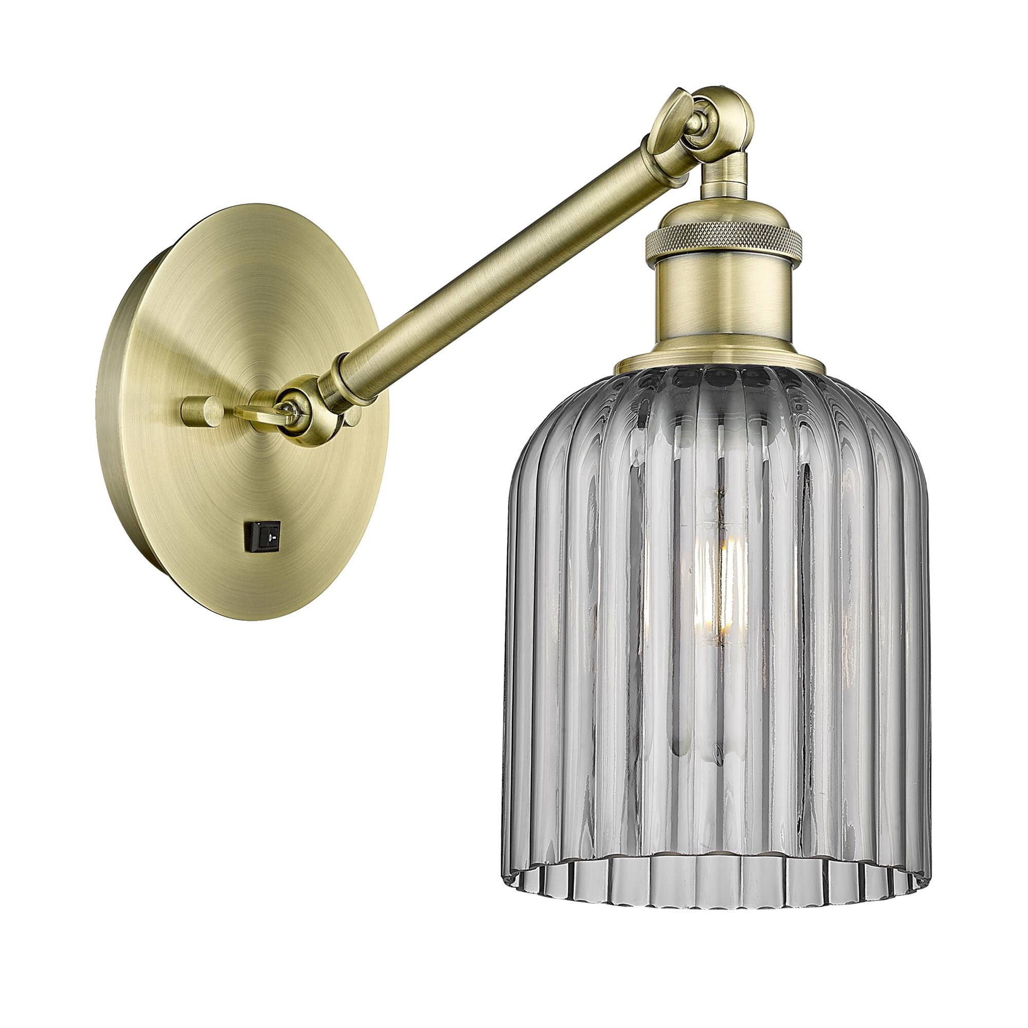 Shown in Antique Brass finish and Light Smoke shade