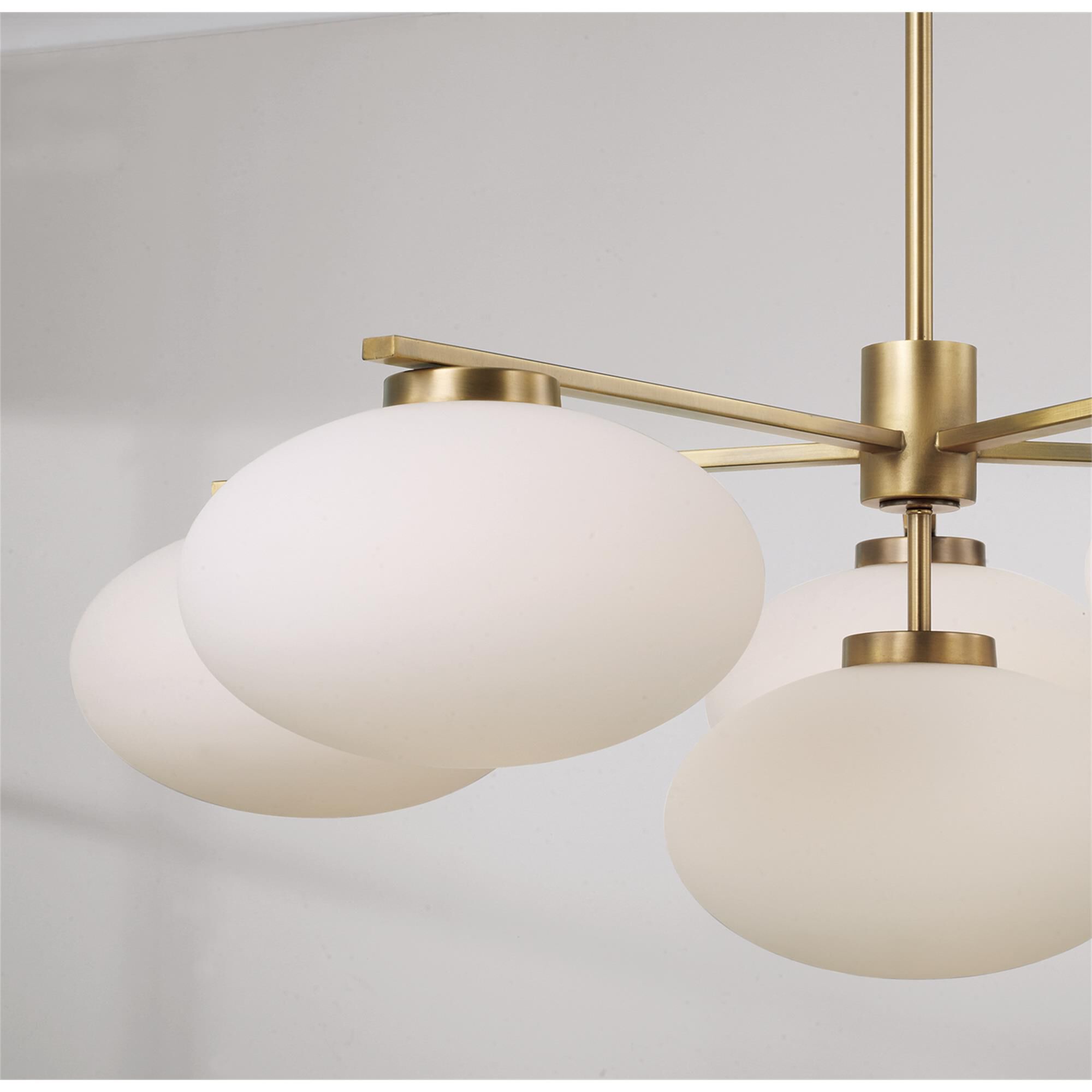 Shown in Aged Brass finish and Soft White glass