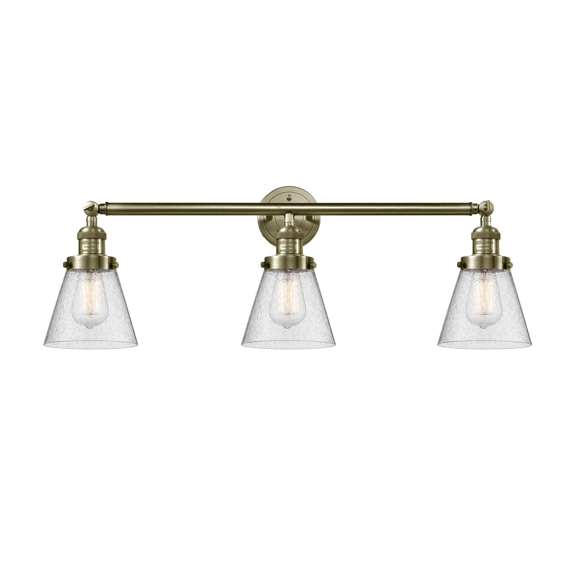 Shown in Antique Brass finish and Seedy glass