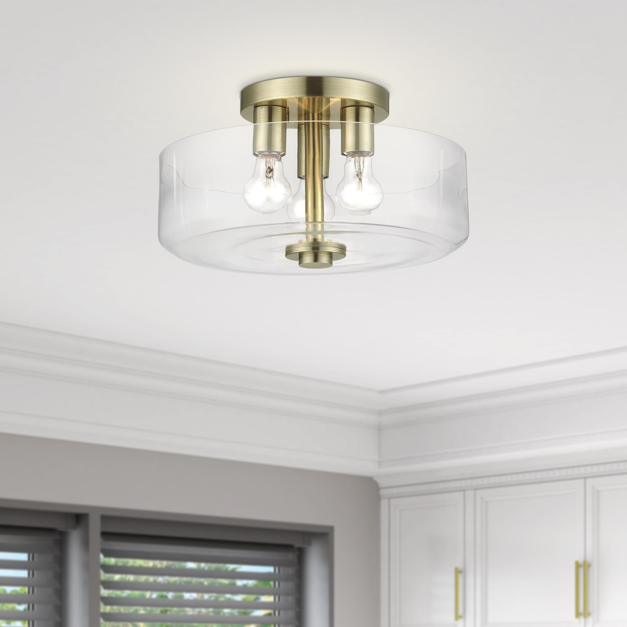 Shown in Antique Brass finish and Mouth Blown Clear glass