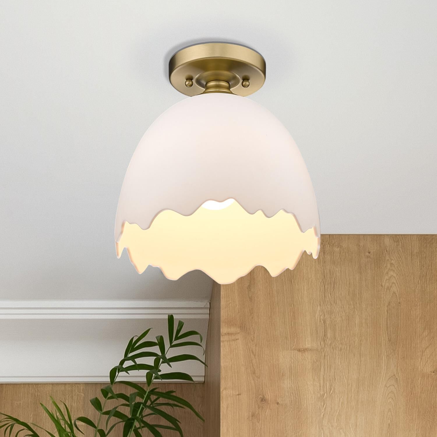 Shown in Brushed Champagne Bronze finish and Porcelain Shade glass