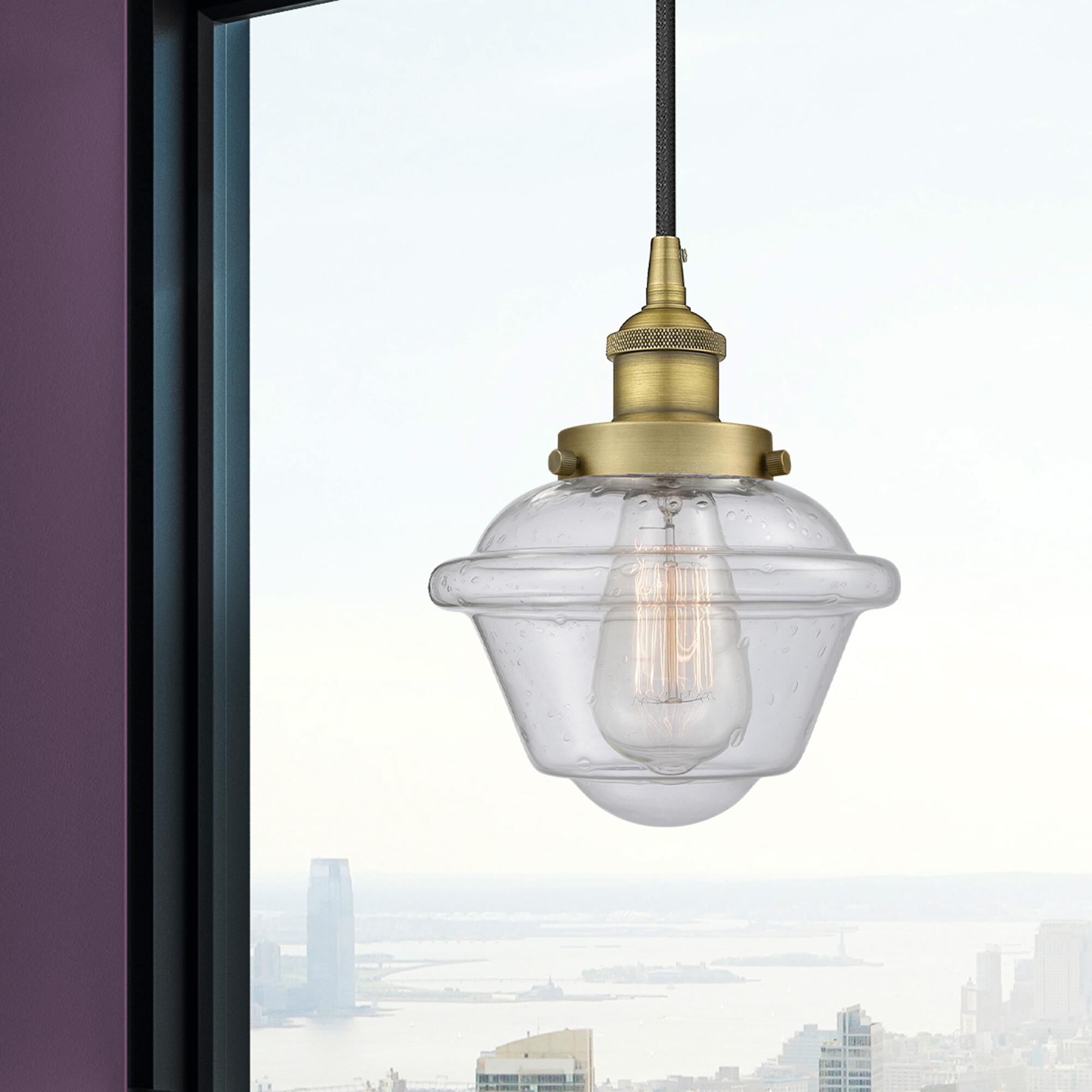 Shown in Brushed Brass finish and Seedy Small Oxford glass