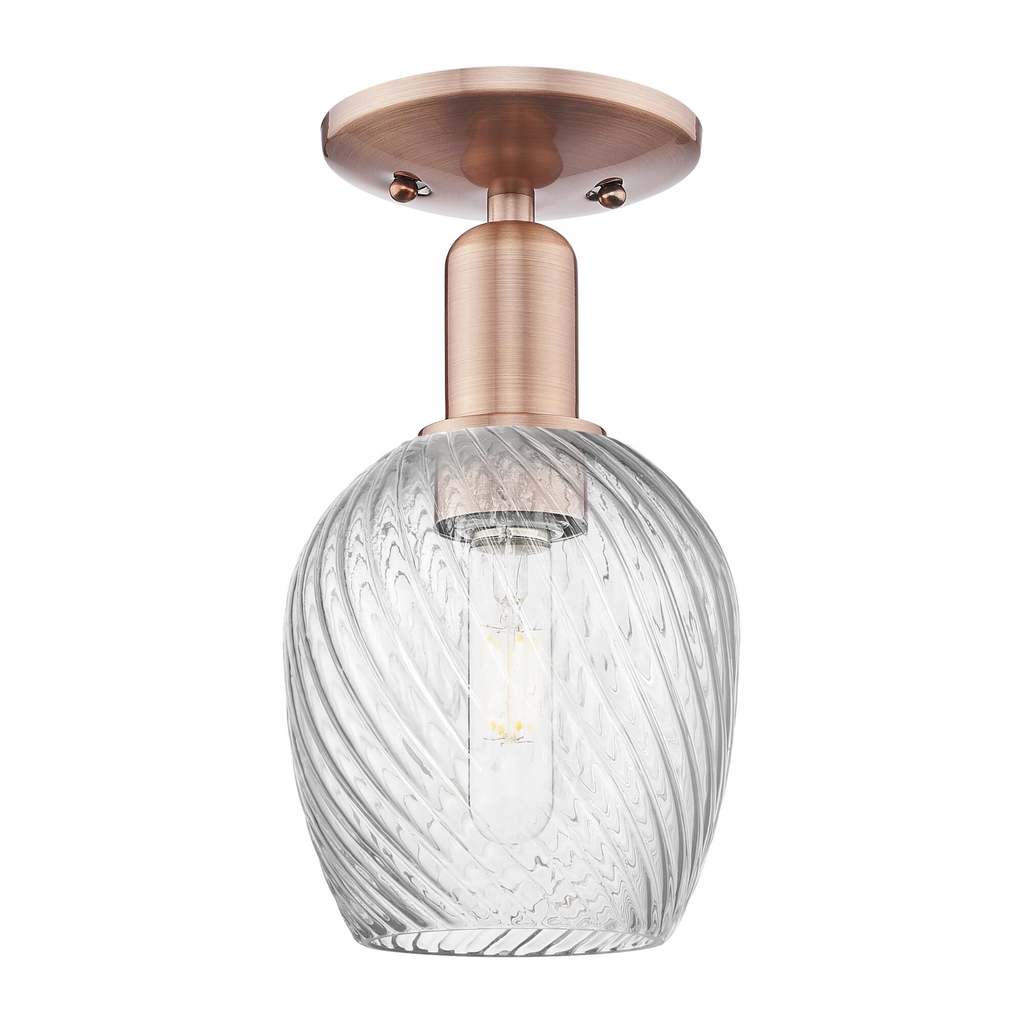 Shown in Antique Copper finish and Clear Spiral Fluted glass