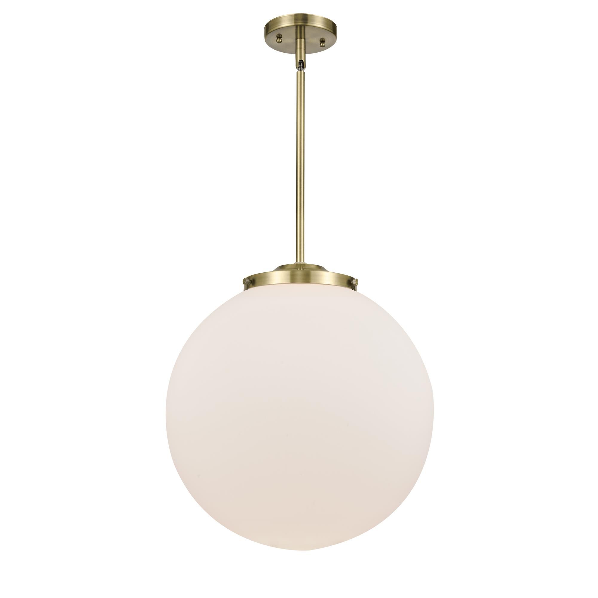 Shown in Antique Brass finish and Matte White Cased Beacon glass