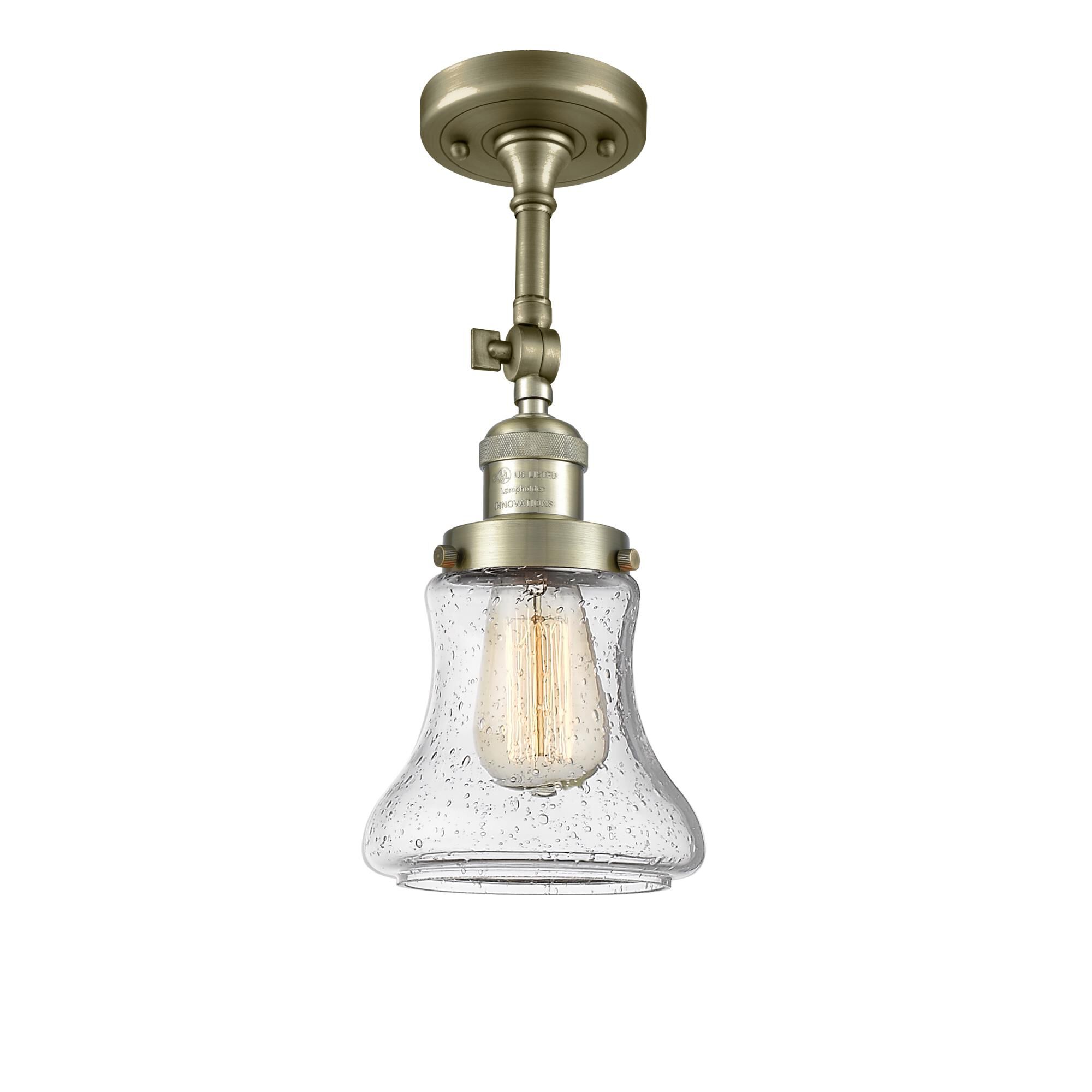 Shown in Antique Brass finish and Seedy glass