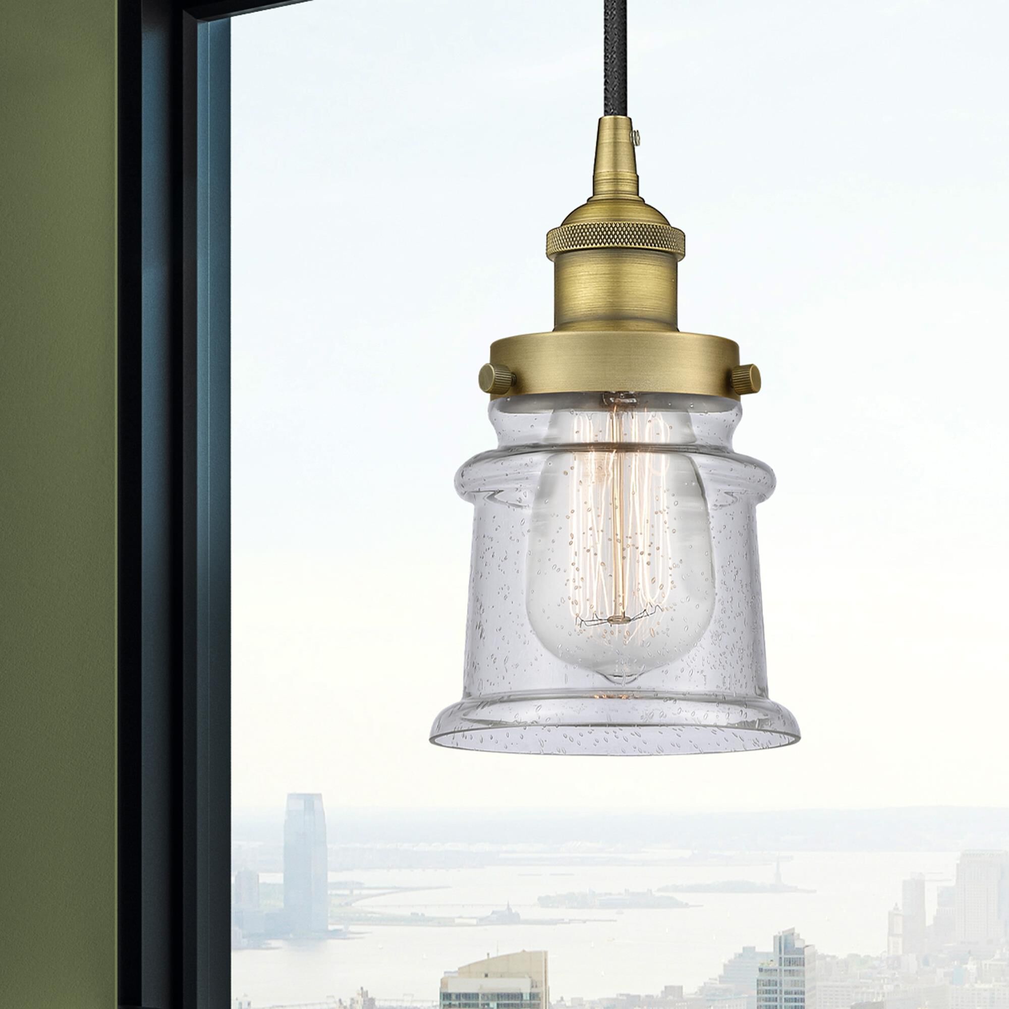 Shown in Brushed Brass finish and Seedy glass