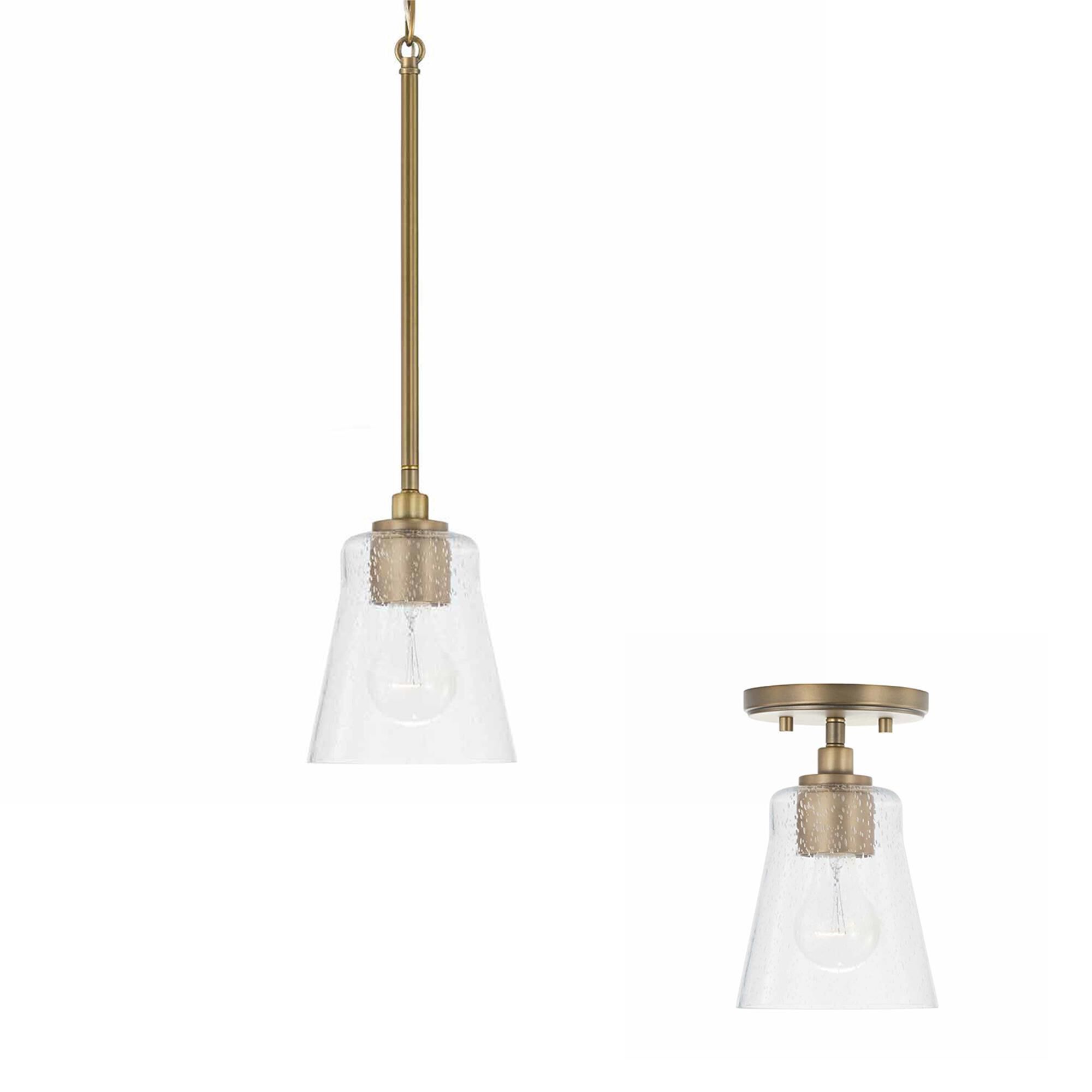Shown in Aged Brass finish and Clear Seeded glass