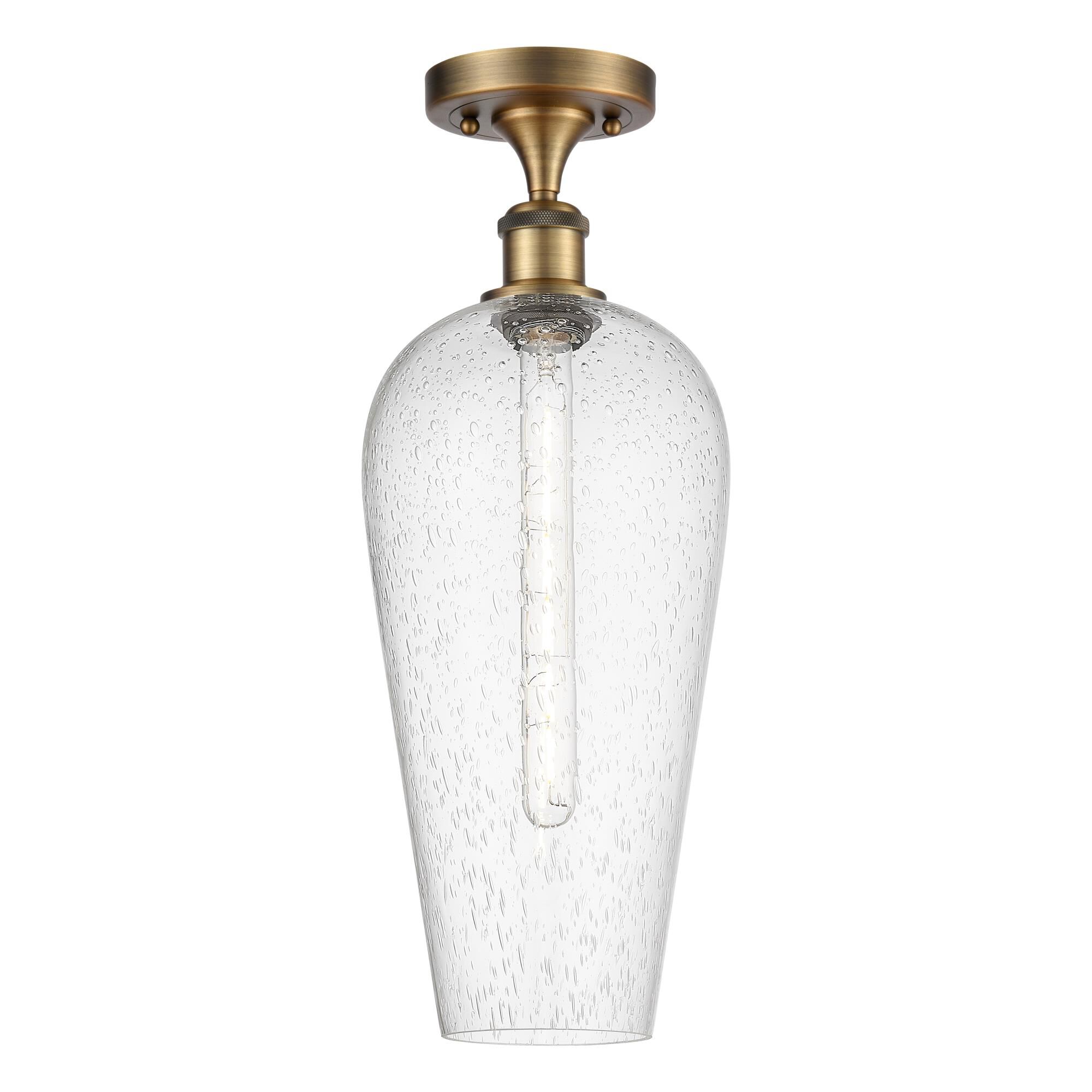 Shown in Brushed Brass finish and Seedy glass