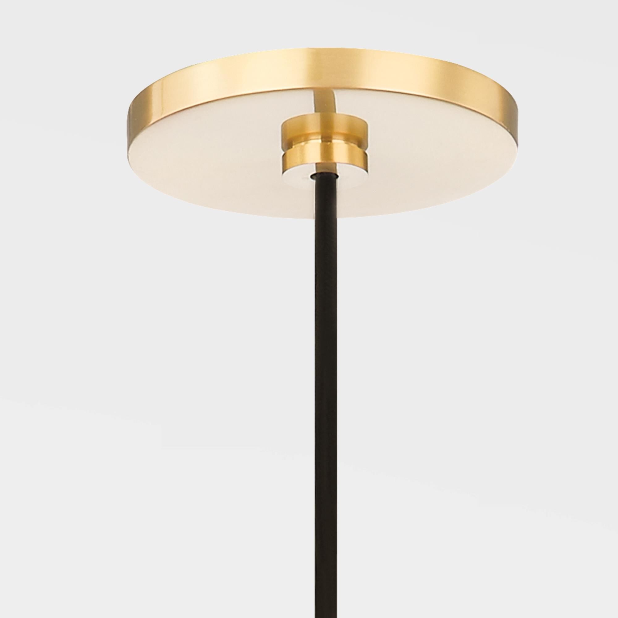 Shown in Aged Brass finish and Natural Linen shade