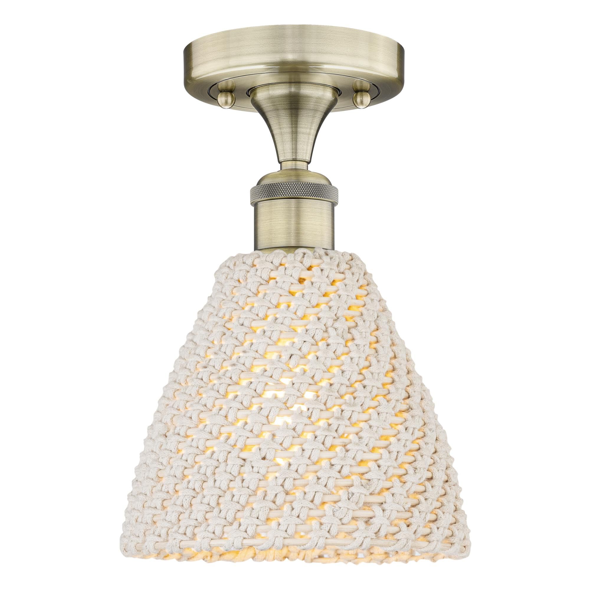 Shown in Antique Brass finish and Natural shade