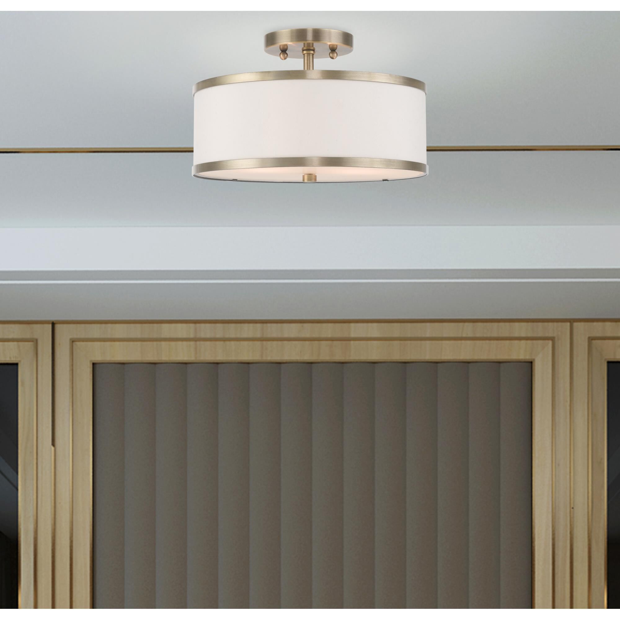 Shown in Antique Brass finish and Hand Crafted Off-White Fabric Hardback shade