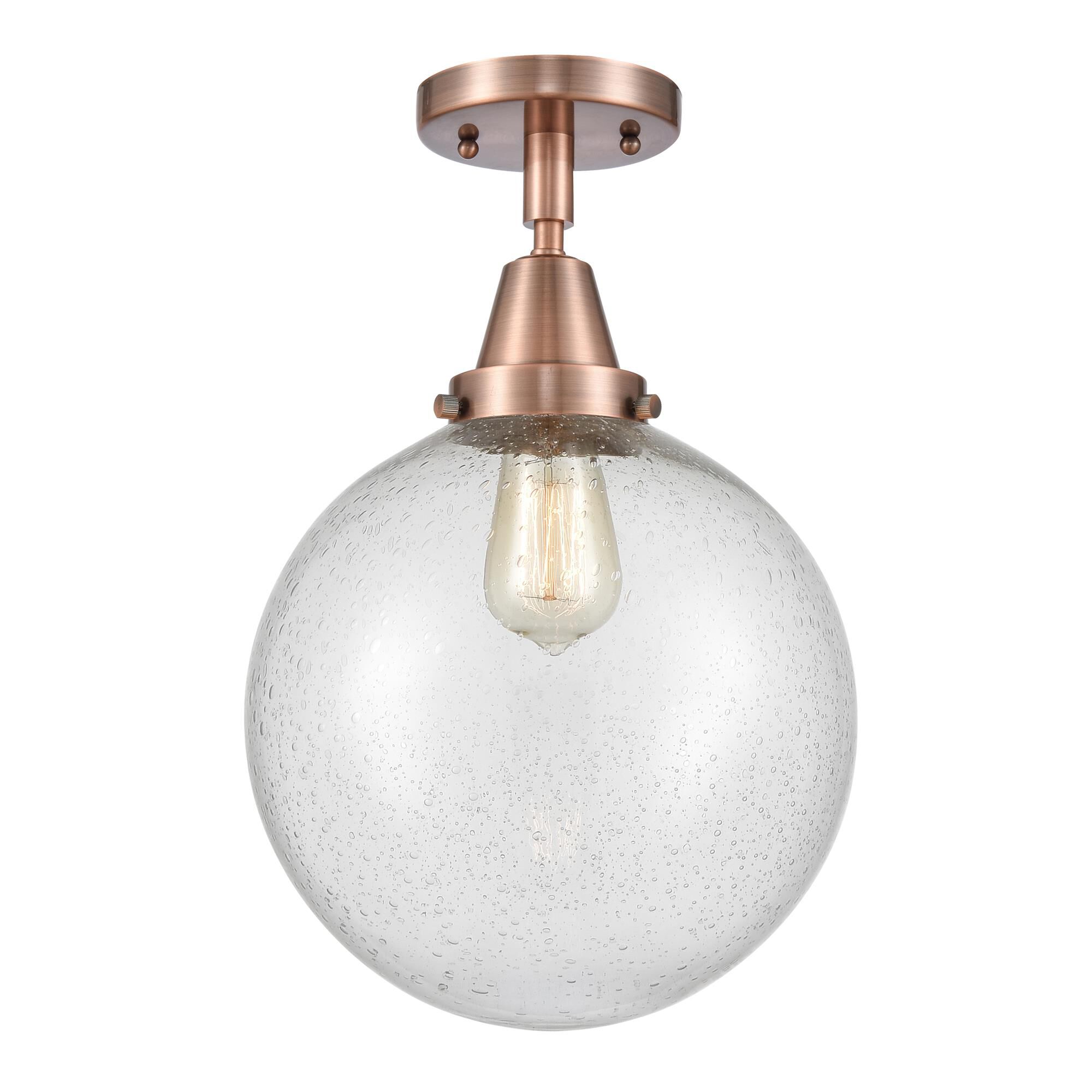 Shown in Antique Copper finish and Seedy Beacon glass